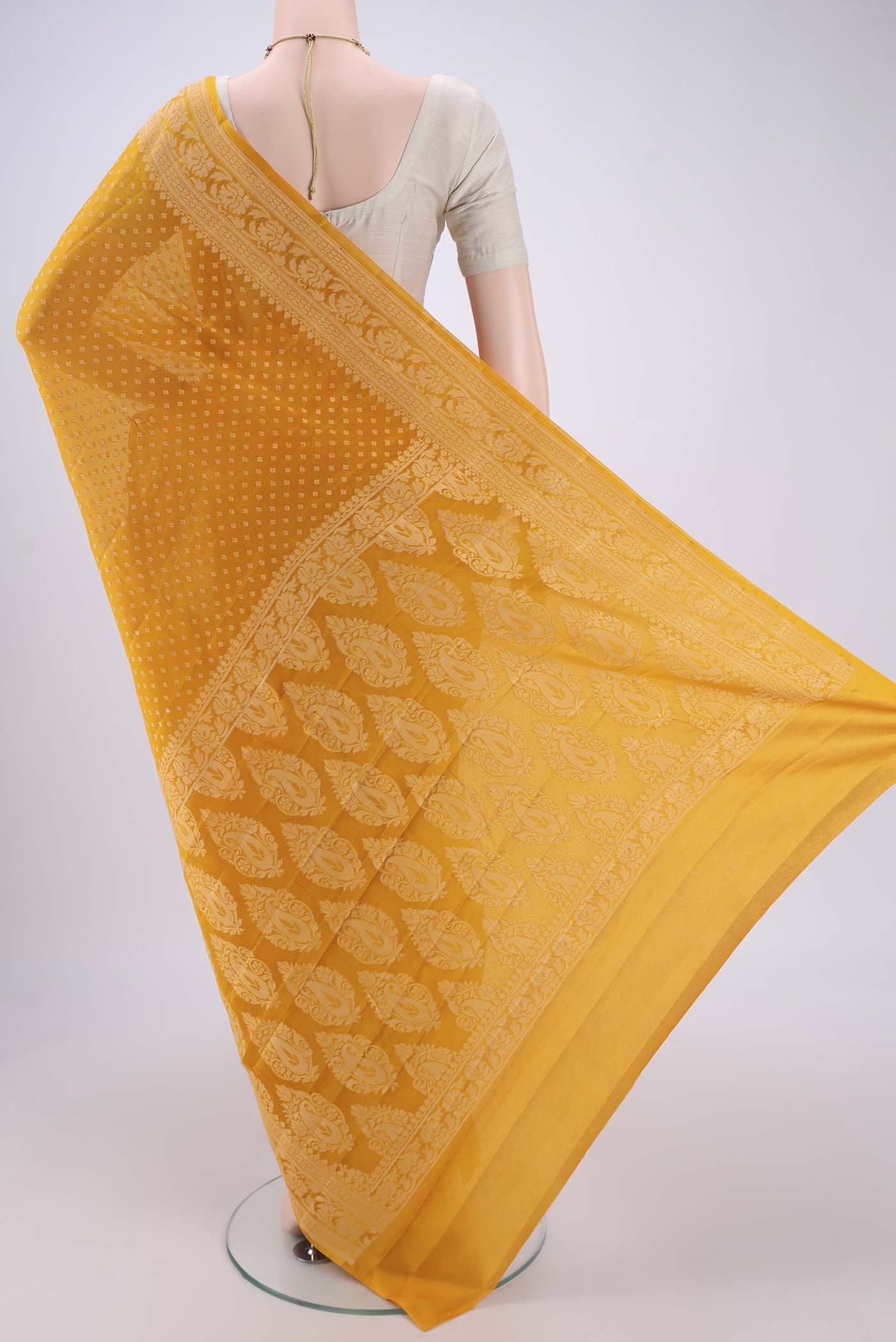 Flat view of Mustard Blended Banarasi Georgette Saree with Thread Butta on the body and Thread Border. 
