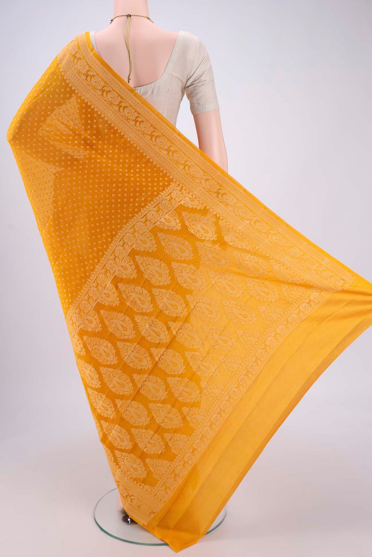 Flat view of Mustard Blended Banarasi Georgette Saree with Thread Butta on the body and Thread Border. 