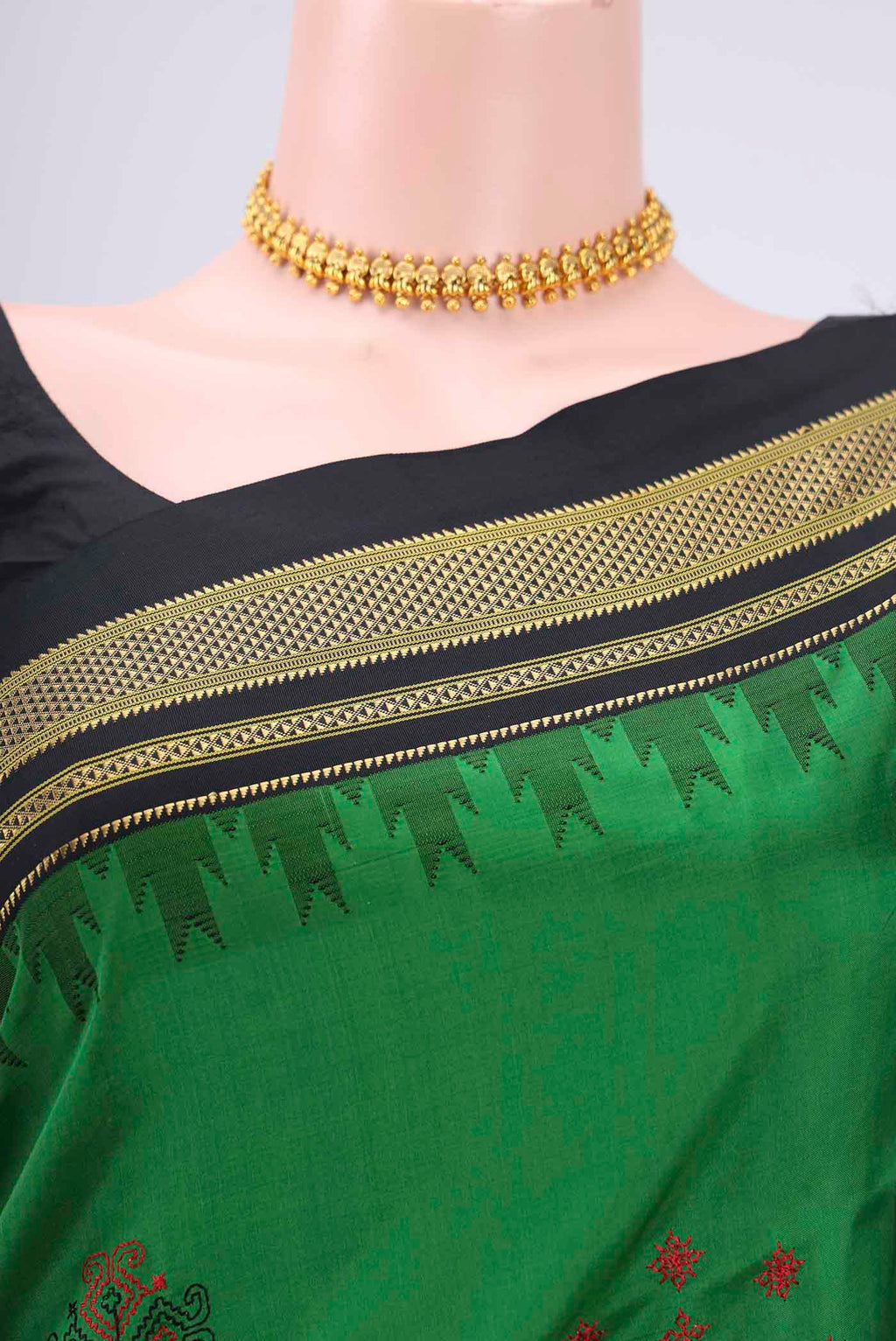 Border image of Green Bangalore Silk Saree with Embroidery on the body and Temple Border. 