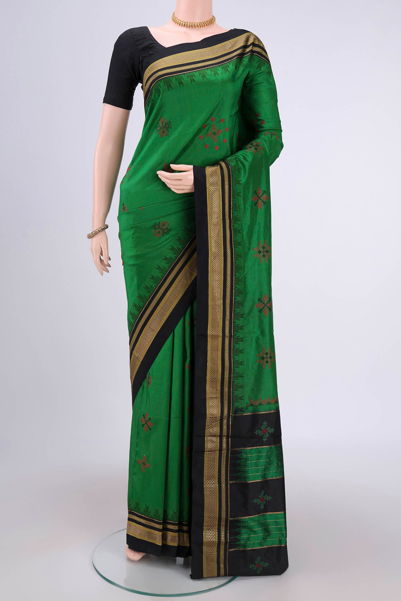 Green Bangalore Silk Saree with Embroidery on the body and Temple Border.  displayed on a mannequin