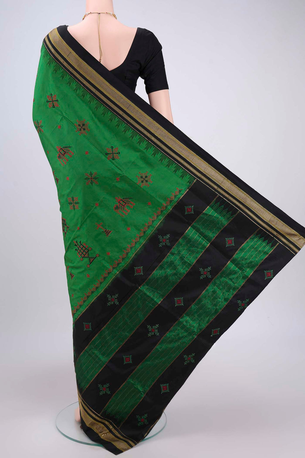 Flat view of Green Bangalore Silk Saree with Embroidery on the body and Temple Border. 