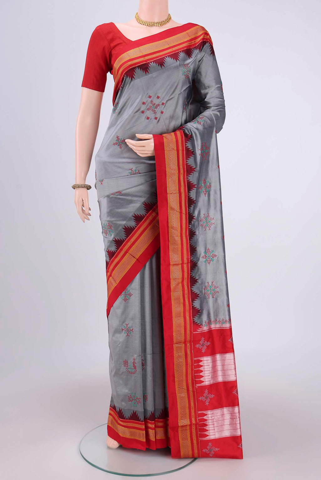 Grey Bangalore Silk Saree with Embroidery on the body and Temple Border.  displayed on a mannequin