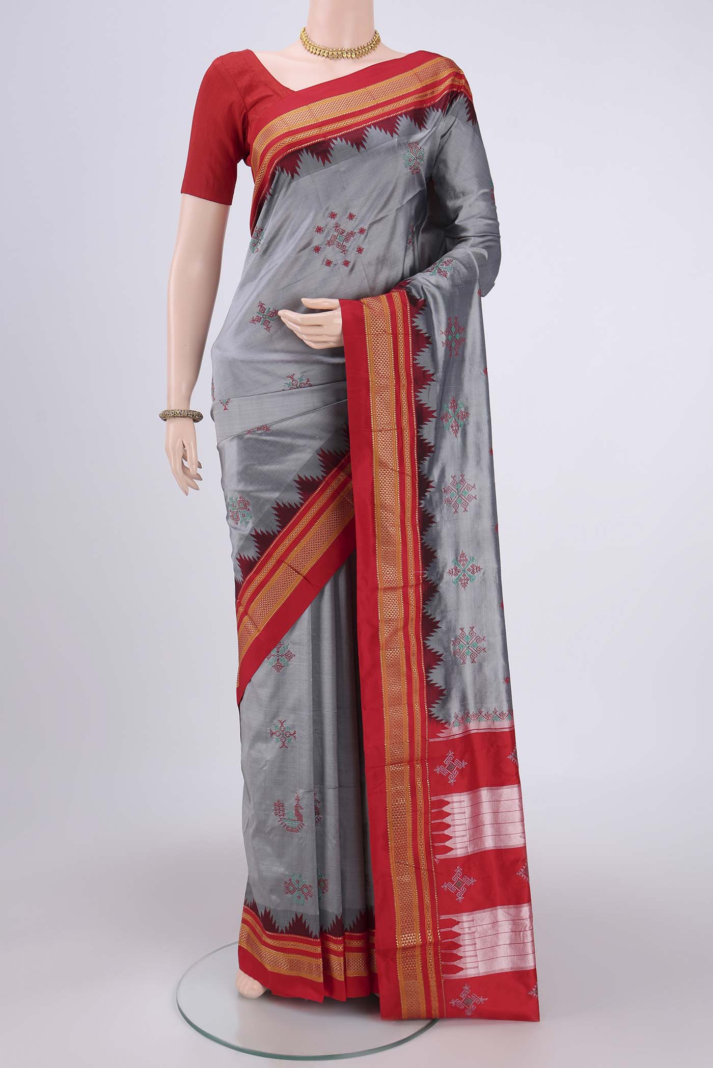 Grey Bangalore Silk Saree with Embroidery on the body and Temple Border.  displayed on a mannequin