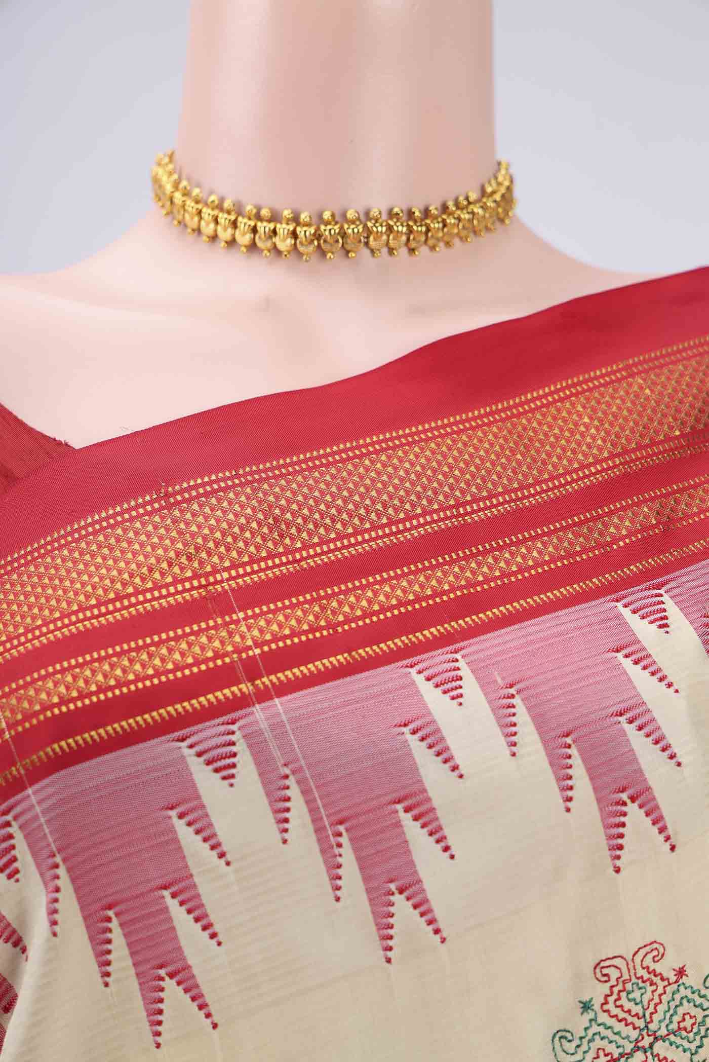 Border image of Cream Bangalore Silk Saree with Embroidery on the body and Temple Border. 