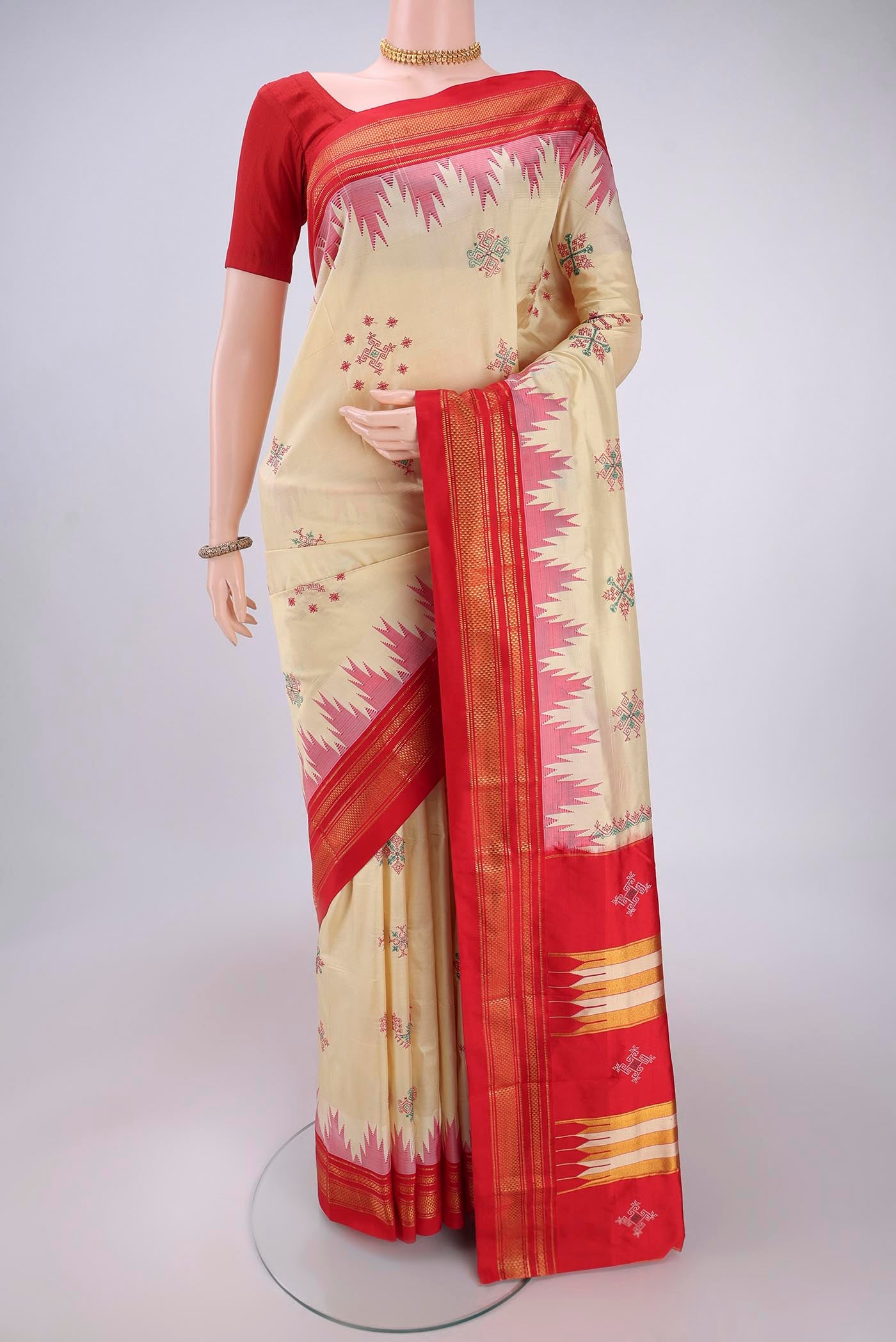 Cream Bangalore Silk Saree with Embroidery on the body and Temple Border.  displayed on a mannequin