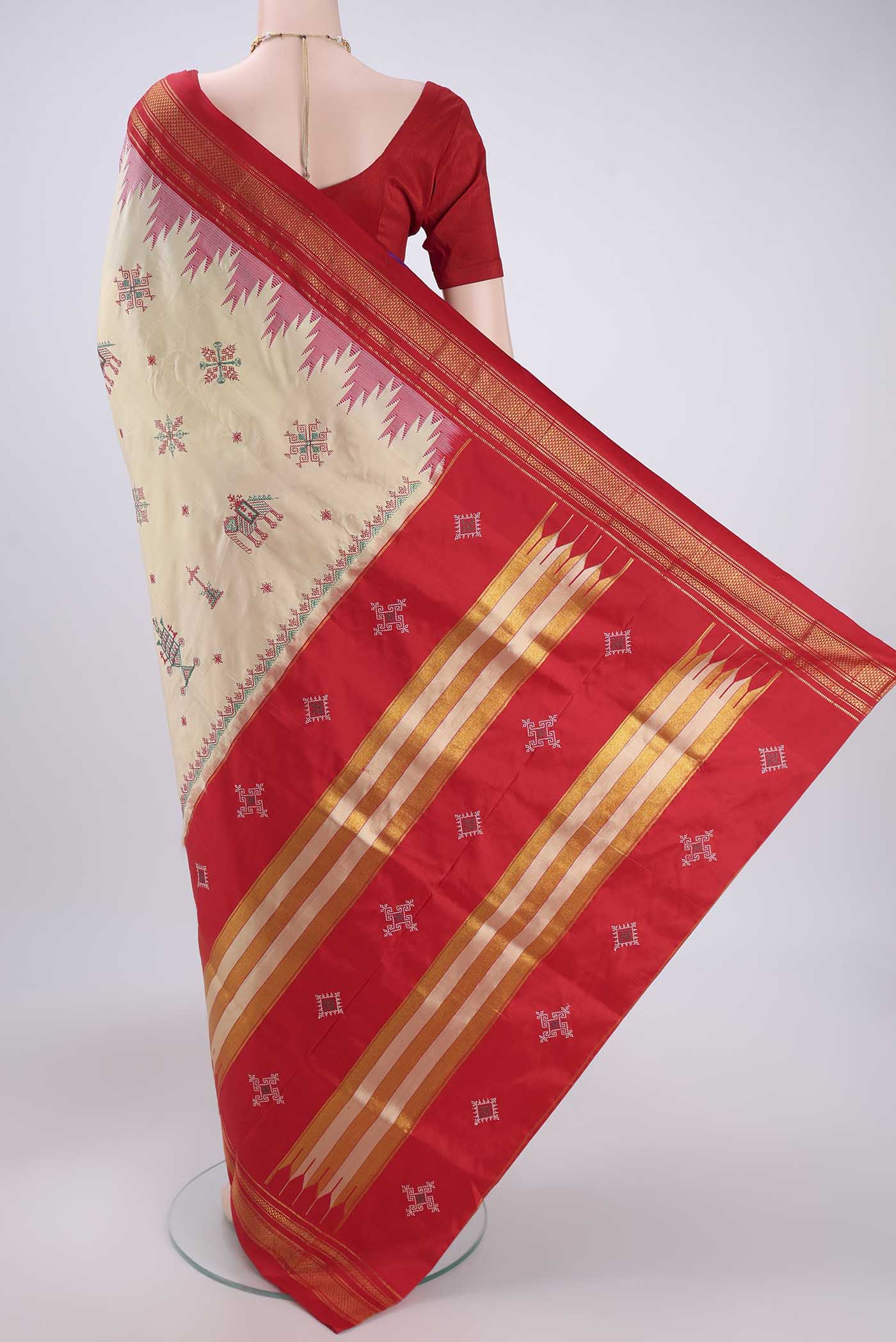 Flat view of Cream Bangalore Silk Saree with Embroidery on the body and Temple Border. 