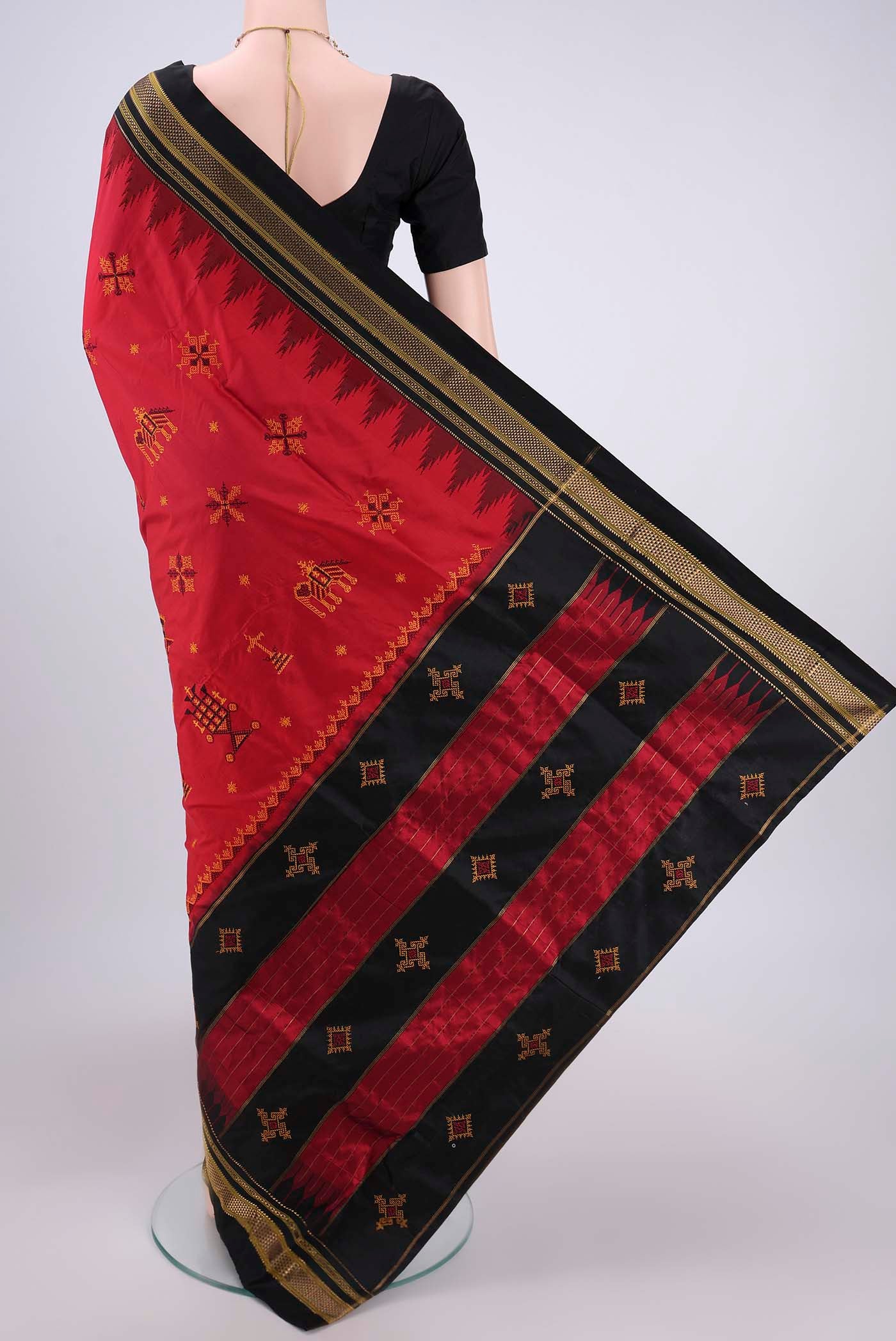 Flat view of Red Bangalore Silk Saree with Embroidery on the body and Temple Border. 