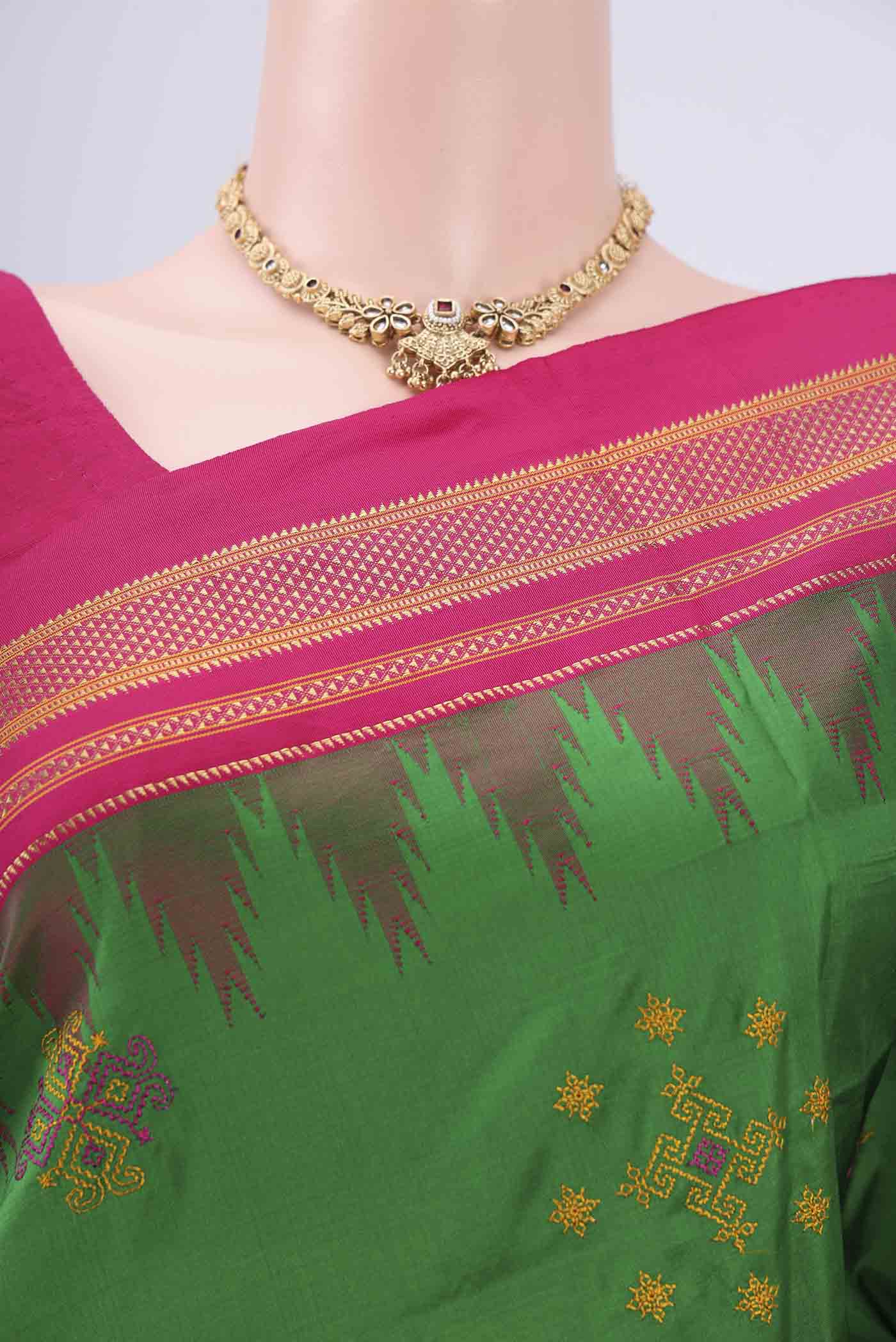 Border image of Green Bangalore Silk Saree with Embroidery on the body and Temple Border. 