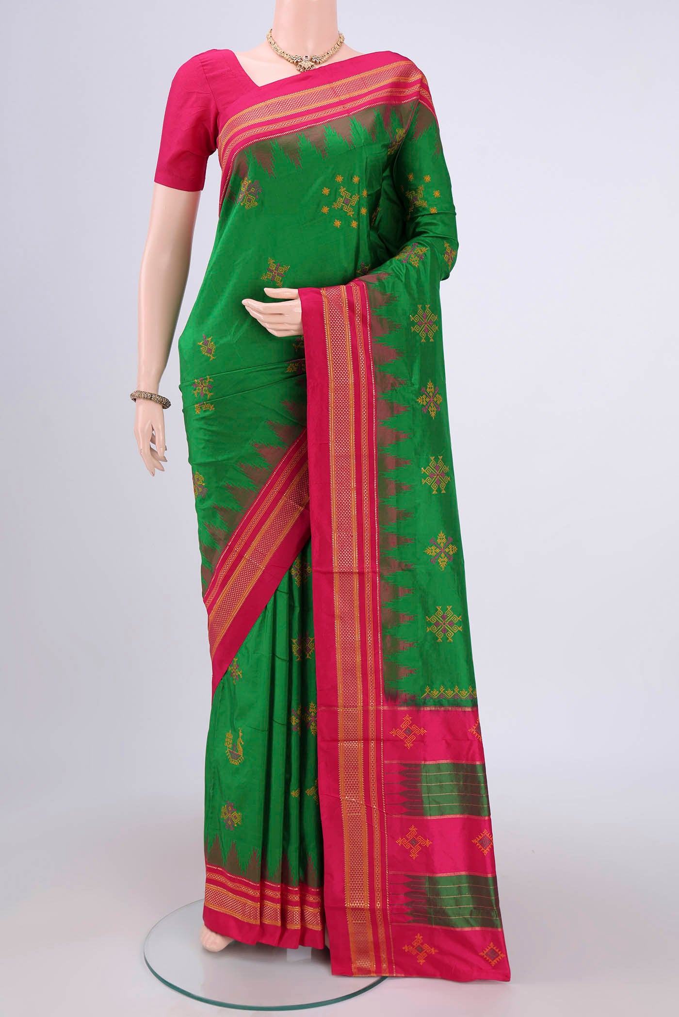 Green Bangalore Silk Saree with Embroidery on the body and Temple Border.  displayed on a mannequin