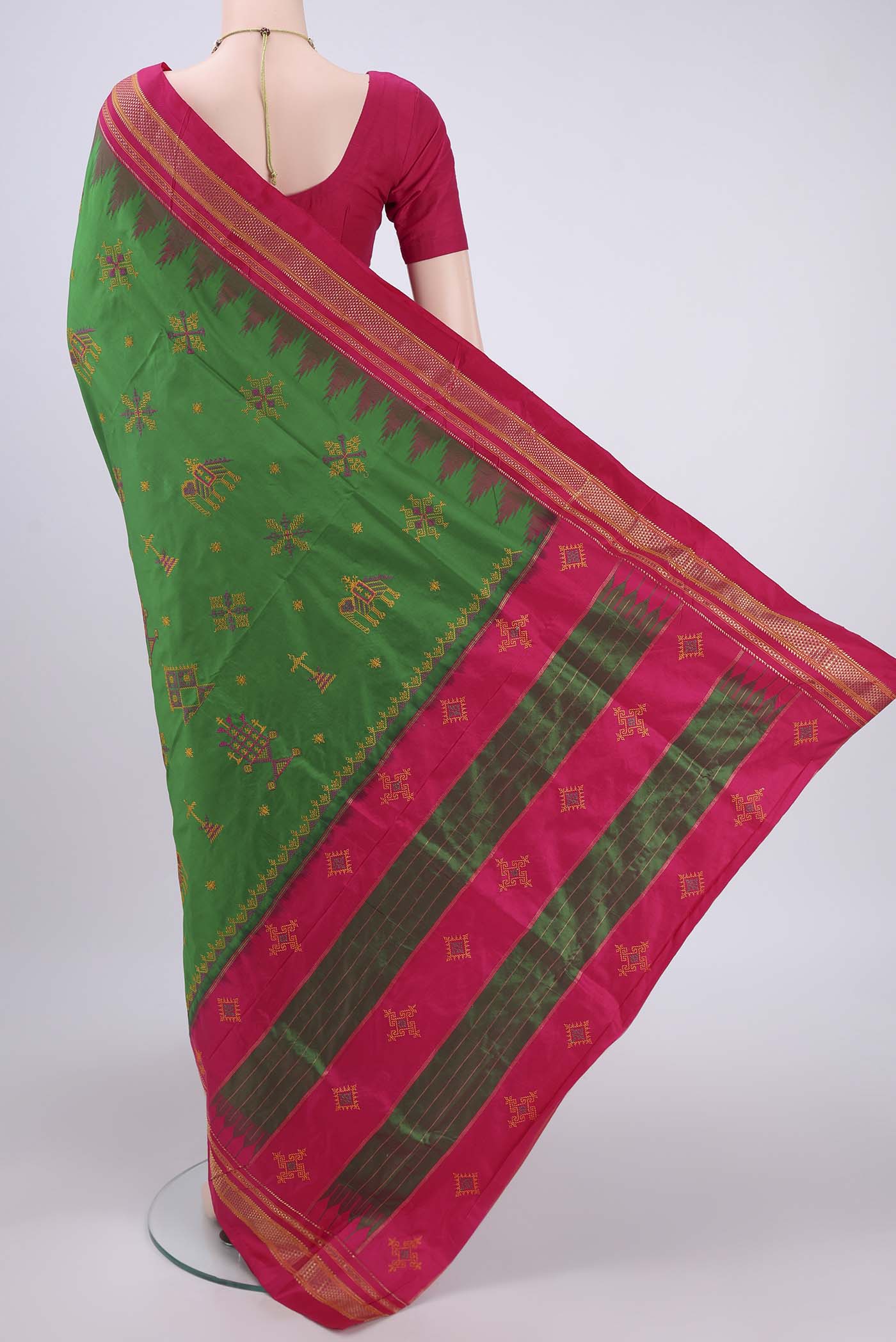 Flat view of Green Bangalore Silk Saree with Embroidery on the body and Temple Border. 