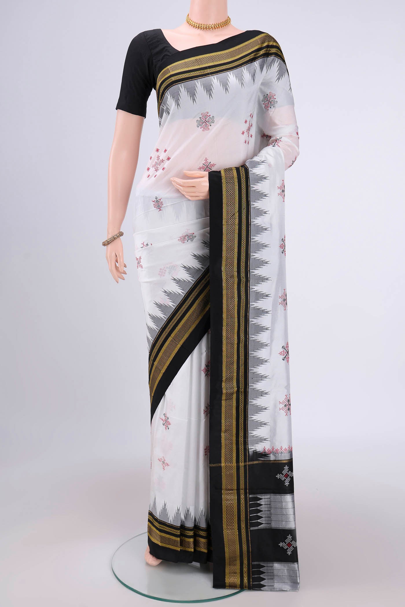 White Bangalore Silk Saree with Embroidery on the body and Temple Border.  displayed on a mannequin
