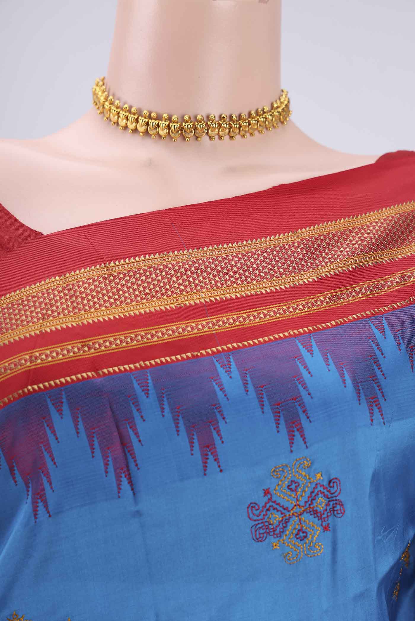 Border image of Blue Bangalore Silk Saree with Embroidery on the body and Temple Border. 