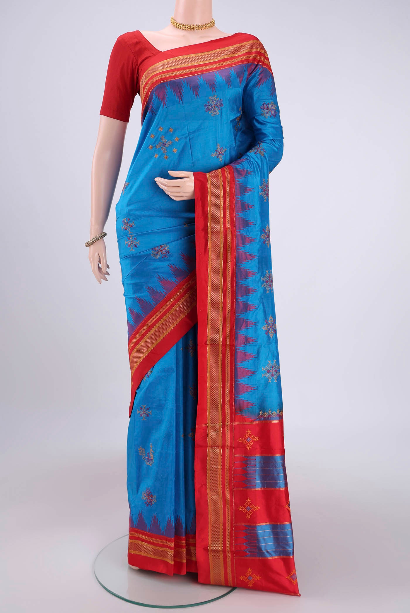 Blue Bangalore Silk Saree with Embroidery on the body and Temple Border.  displayed on a mannequin
