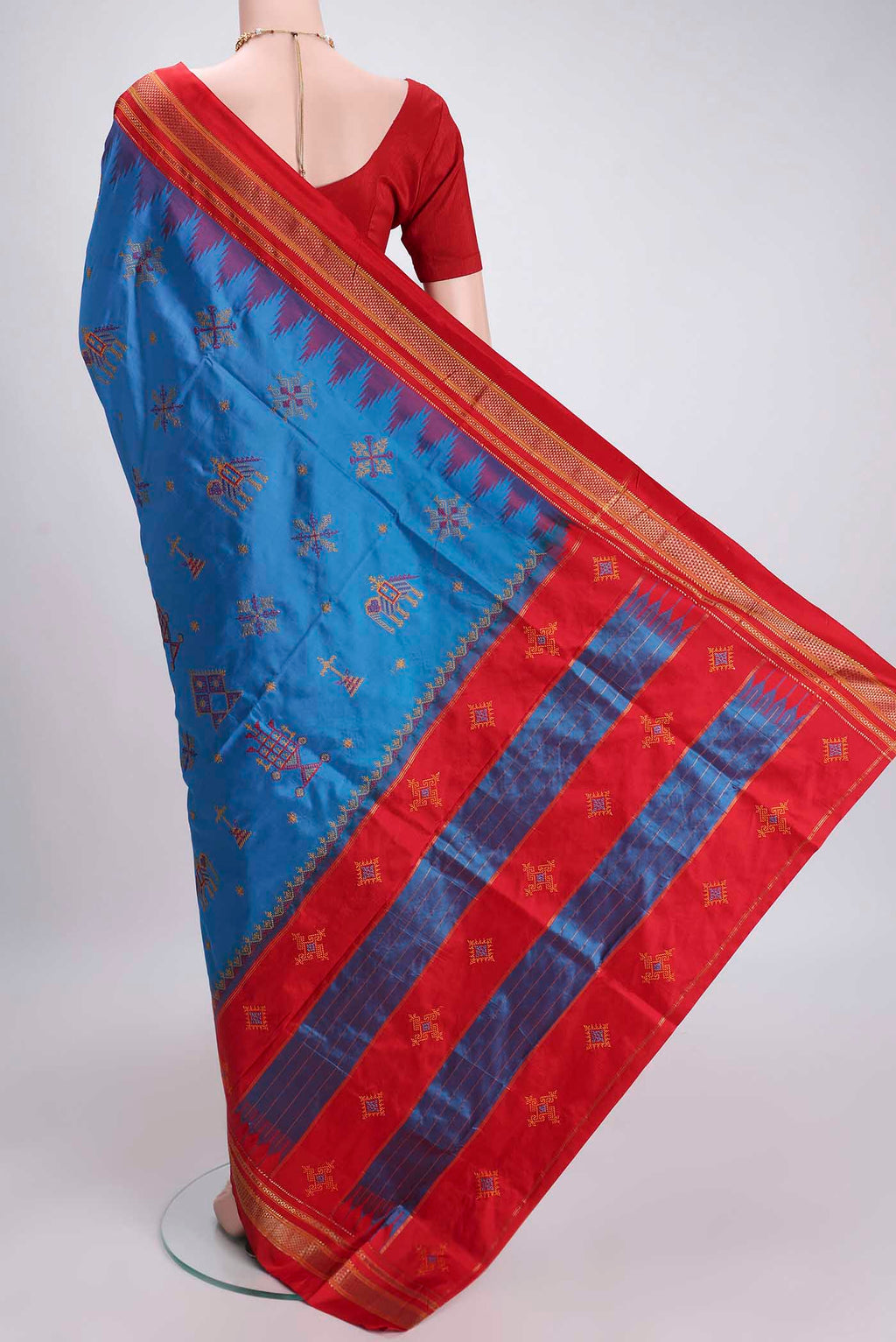 Flat view of Blue Bangalore Silk Saree with Embroidery on the body and Temple Border. 