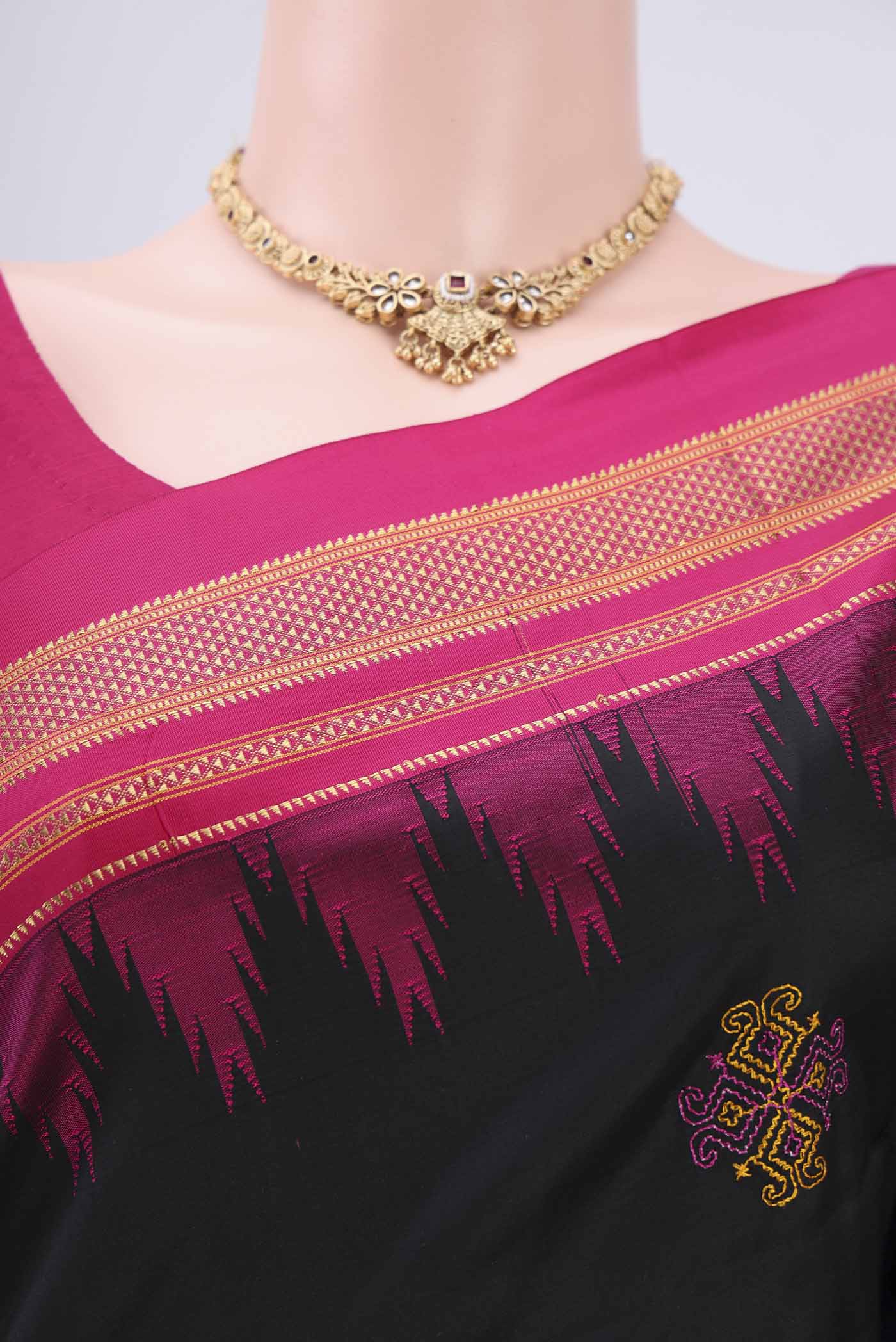 Border image of Black Bangalore Silk Saree with Embroidery on the body and Temple Border. 