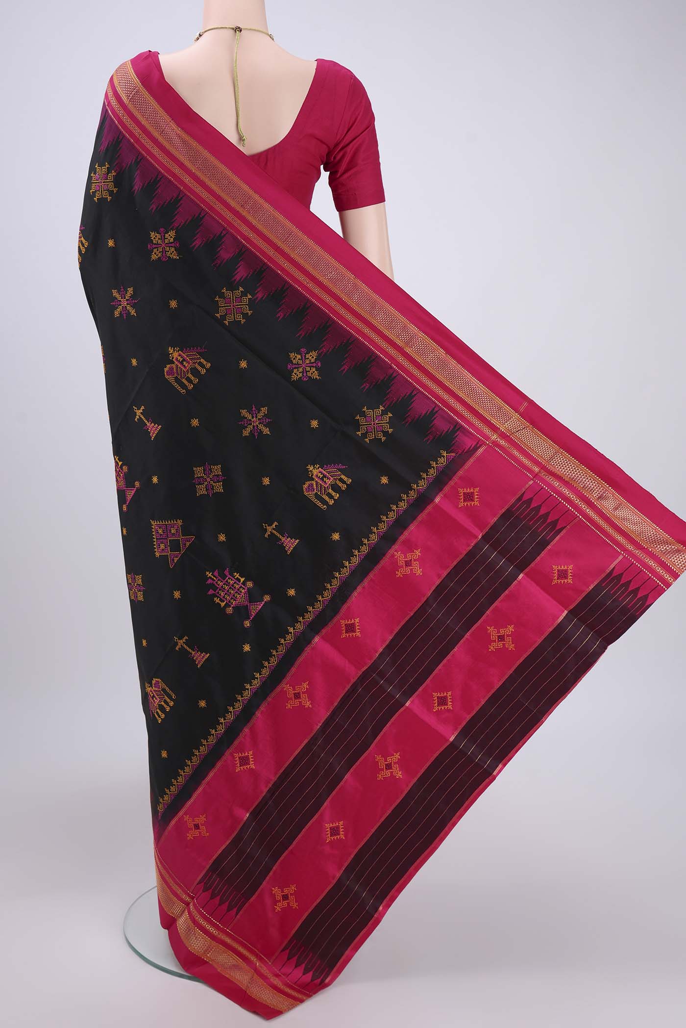 Flat view of Black Bangalore Silk Saree with Embroidery on the body and Temple Border. 