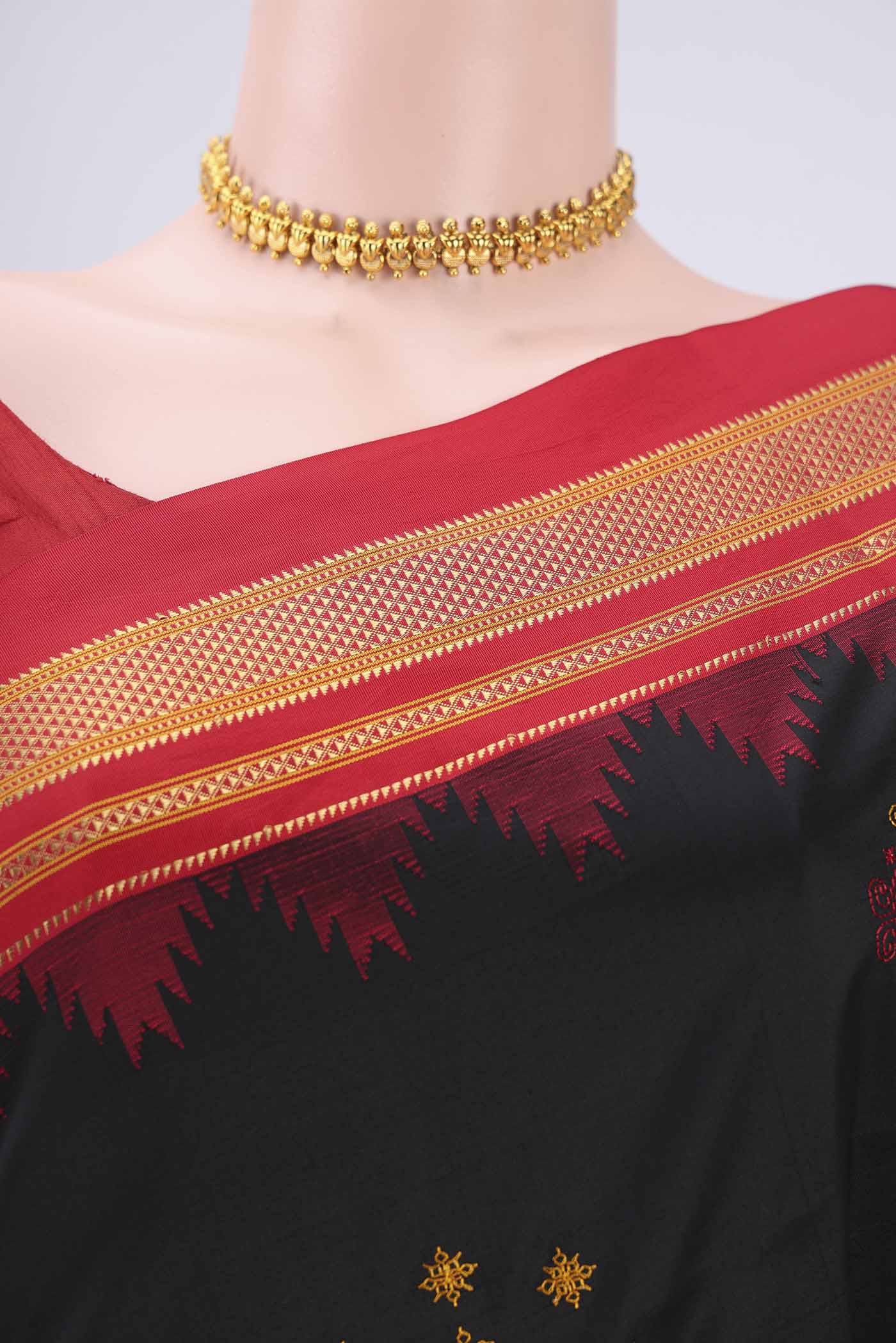 Border image of Black Bangalore Silk Saree with Embroidery on the body and Temple Border. 