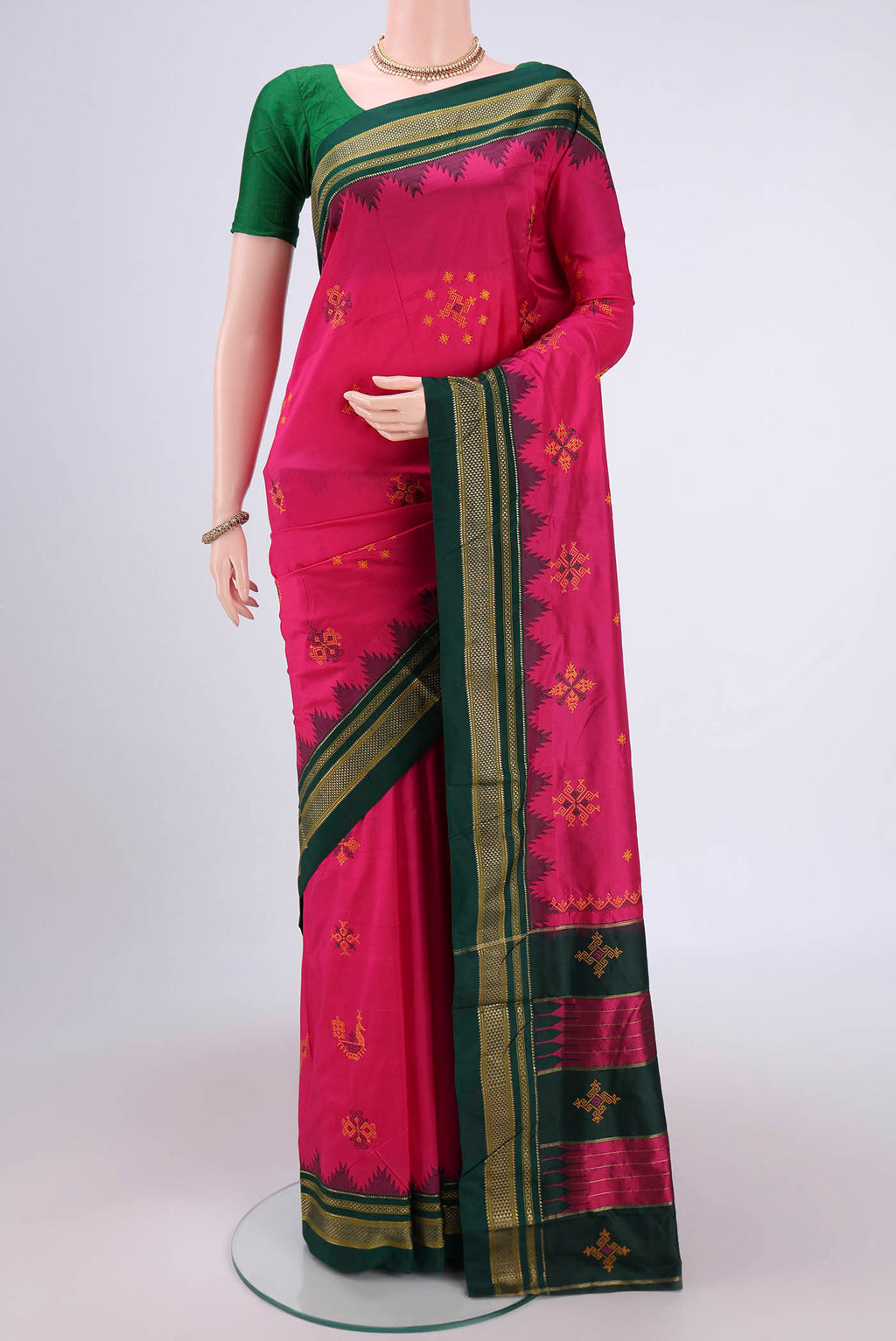 Rani Pink Bangalore Silk Saree with Embroidery on the body and Temple Border.  displayed on a mannequin