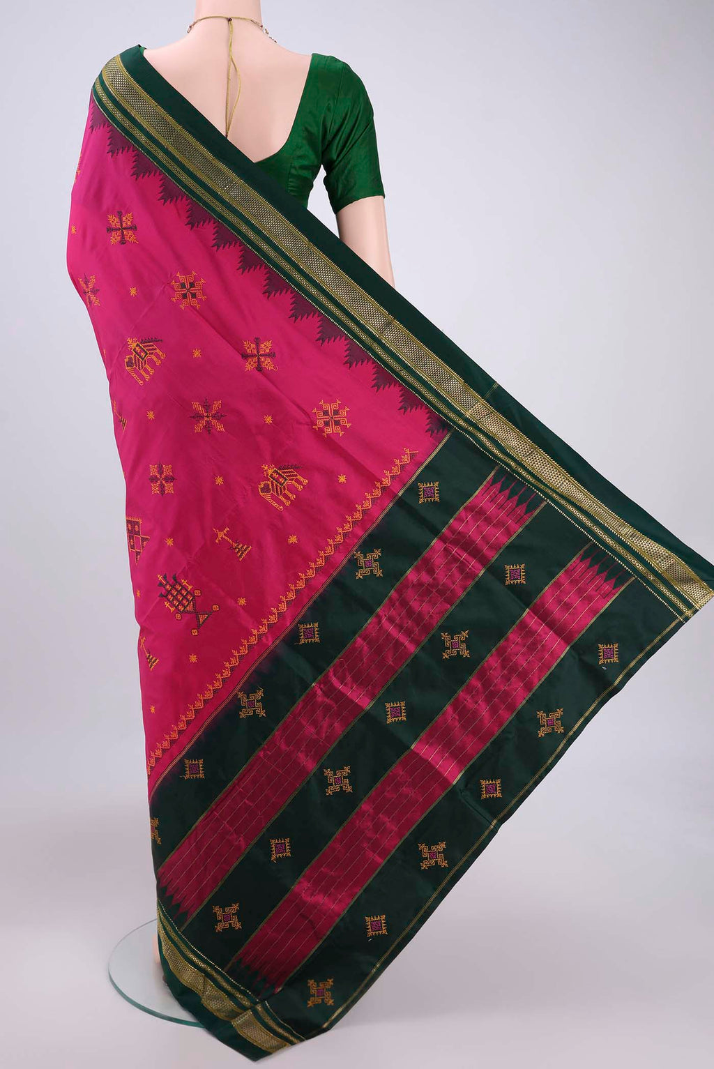 Flat view of Rani Pink Bangalore Silk Saree with Embroidery on the body and Temple Border. 