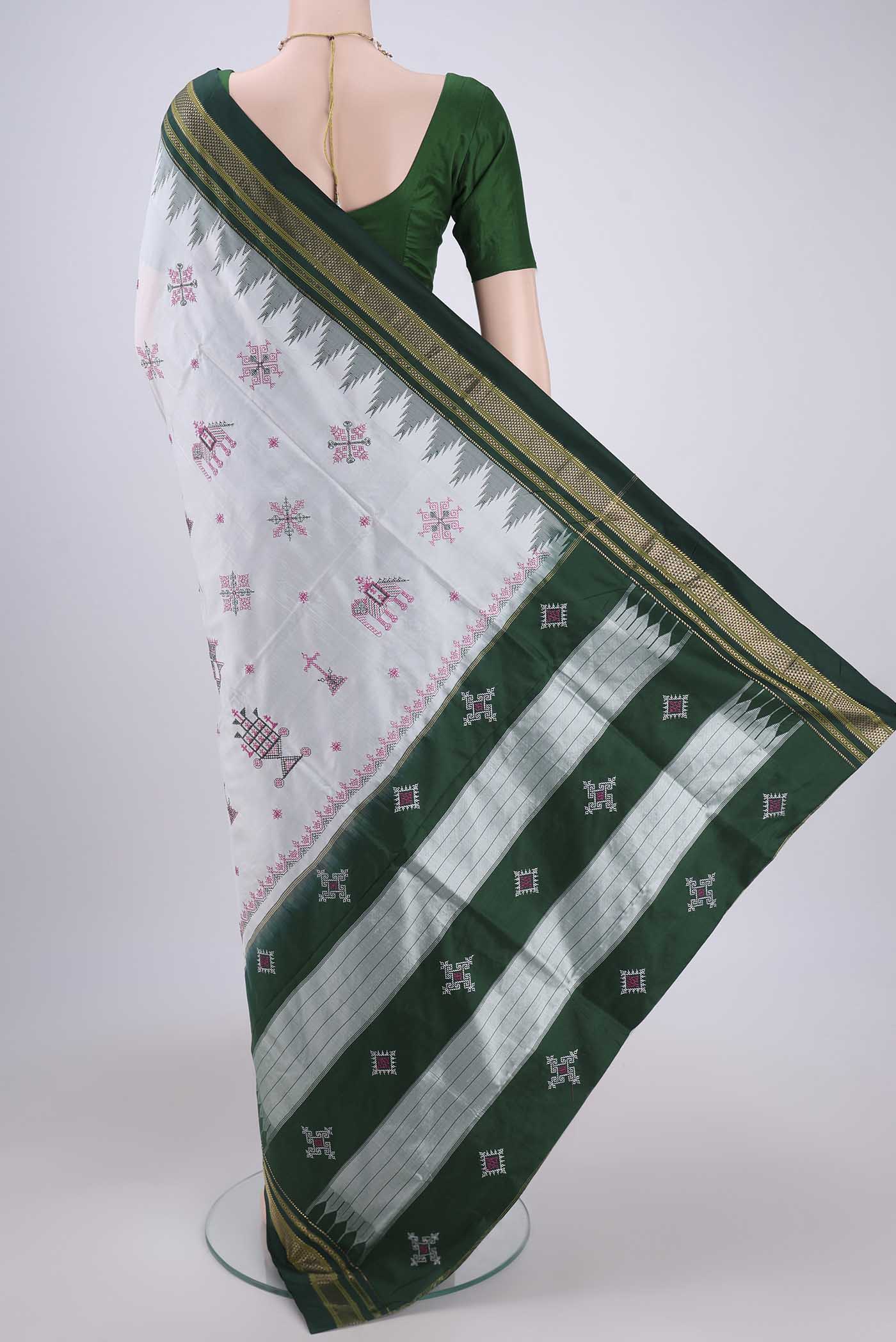 Flat view of White Bangalore Silk Saree with Embroidery on the body and Temple Border. 