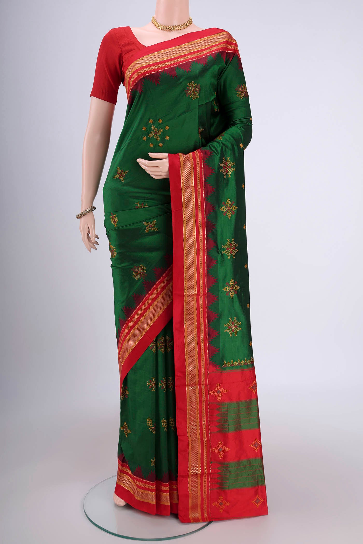 Bottle Green Bangalore Silk Saree with Embroidery on the body and Temple Border.  displayed on a mannequin