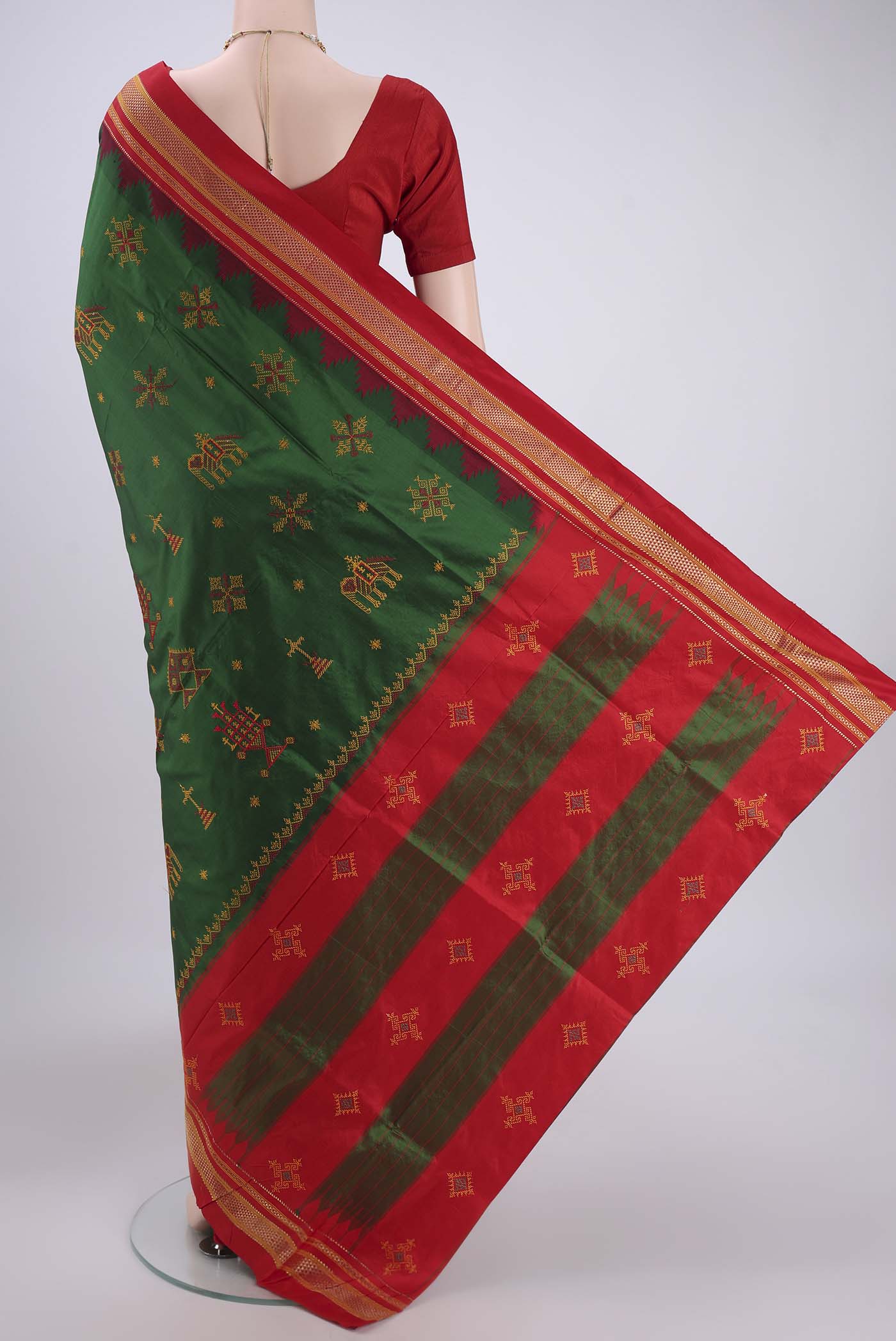 Flat view of Bottle Green Bangalore Silk Saree with Embroidery on the body and Temple Border. 