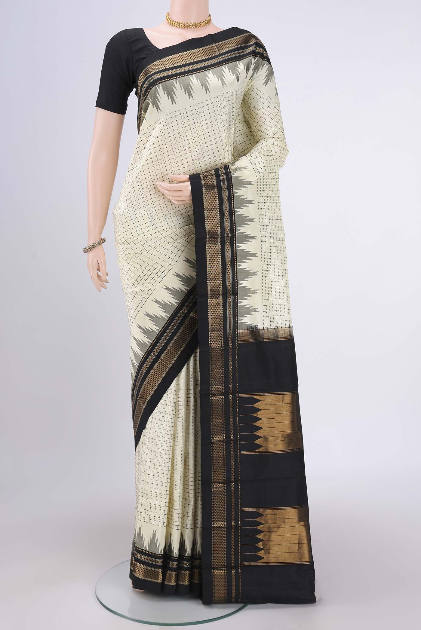 Off White Bangalore Silk Saree with Checked design on the body and Temple Border.  displayed on a mannequin