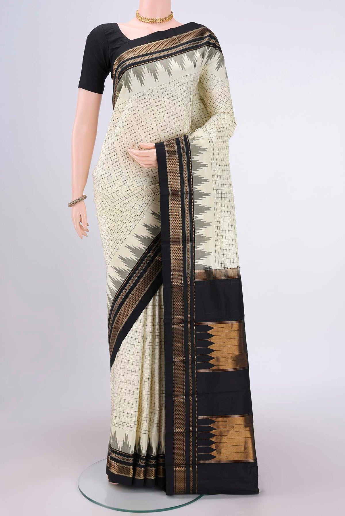 Off White Bangalore Silk Saree with Checked design on the body and Temple Border.  displayed on a mannequin