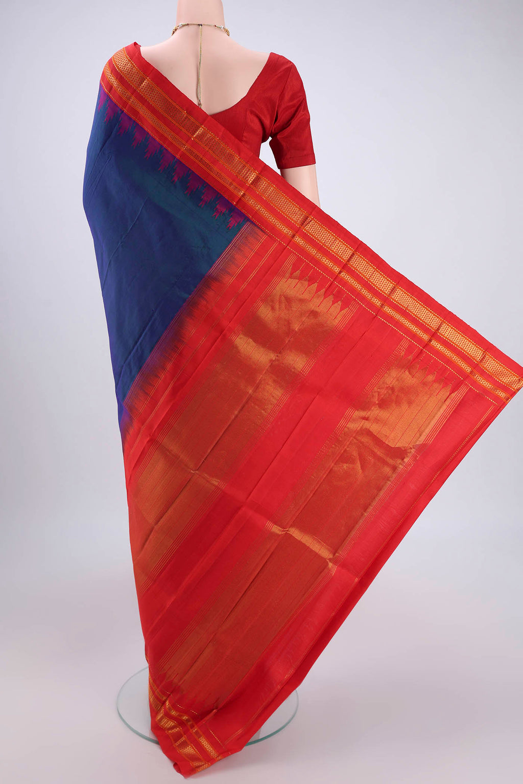 Flat view of Peacock Blue Bangalore Silk Saree with Plain Body and Temple Border. 