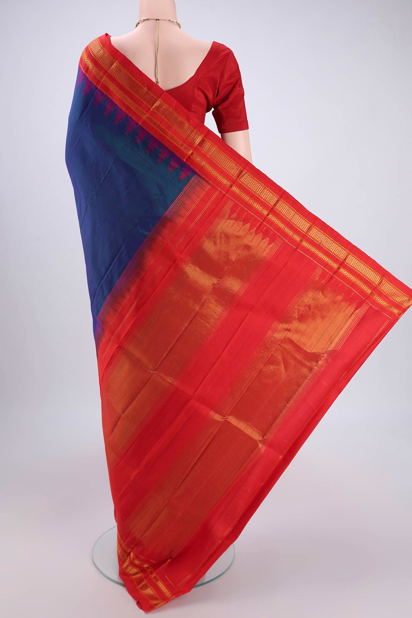 Flat view of Peacock Blue Bangalore Silk Saree with Plain Body and Temple Border. 