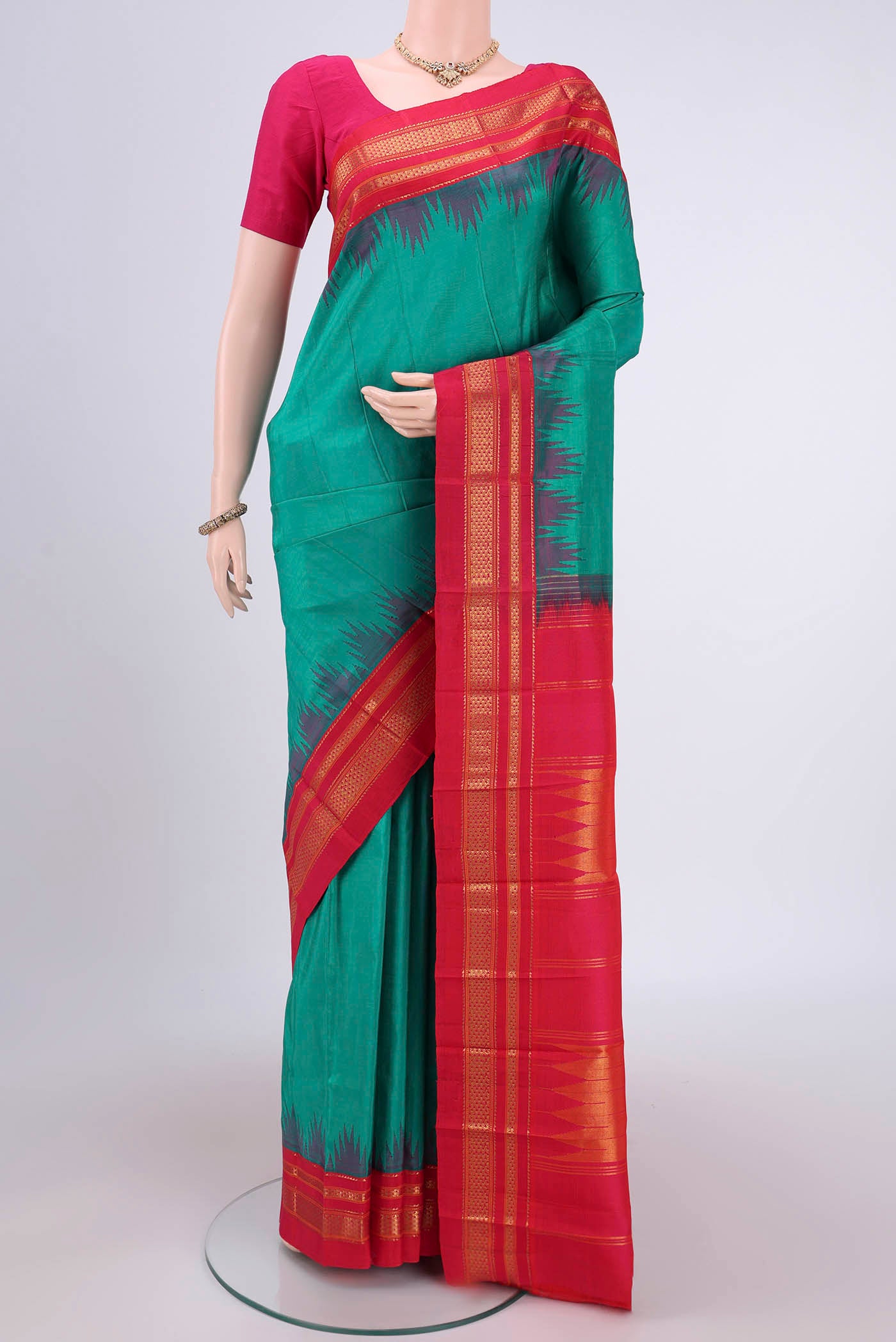Sea Green Bangalore Silk Saree with Plain Body and Temple Border.  displayed on a mannequin