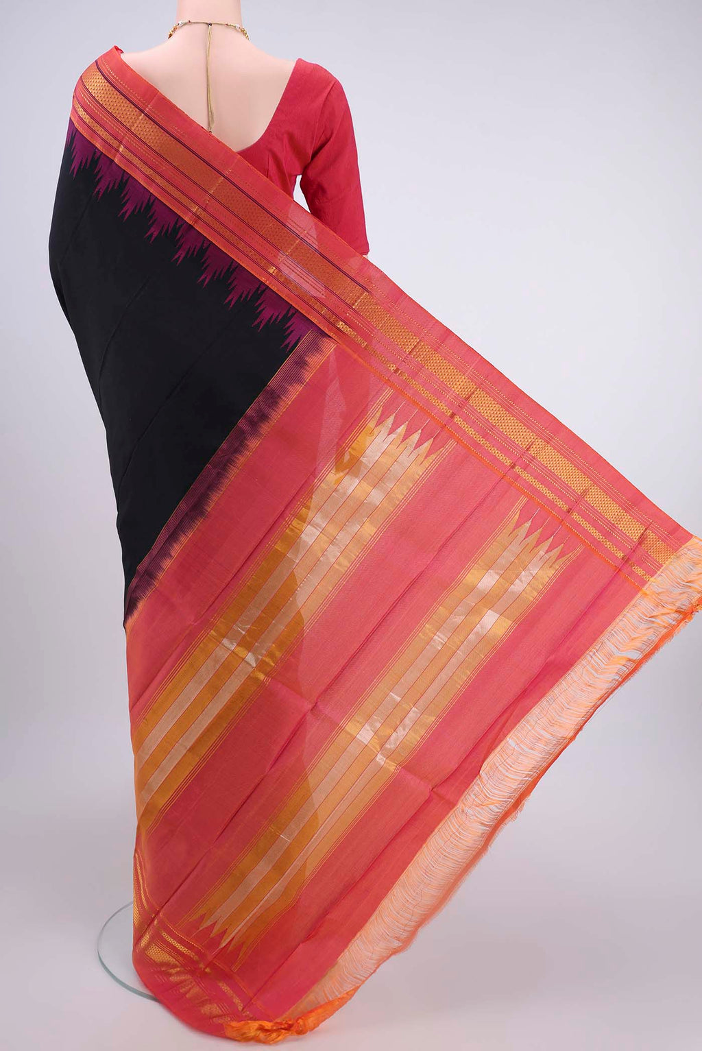 Flat view of Black Bangalore Silk Saree with Plain Body and Temple Border. 