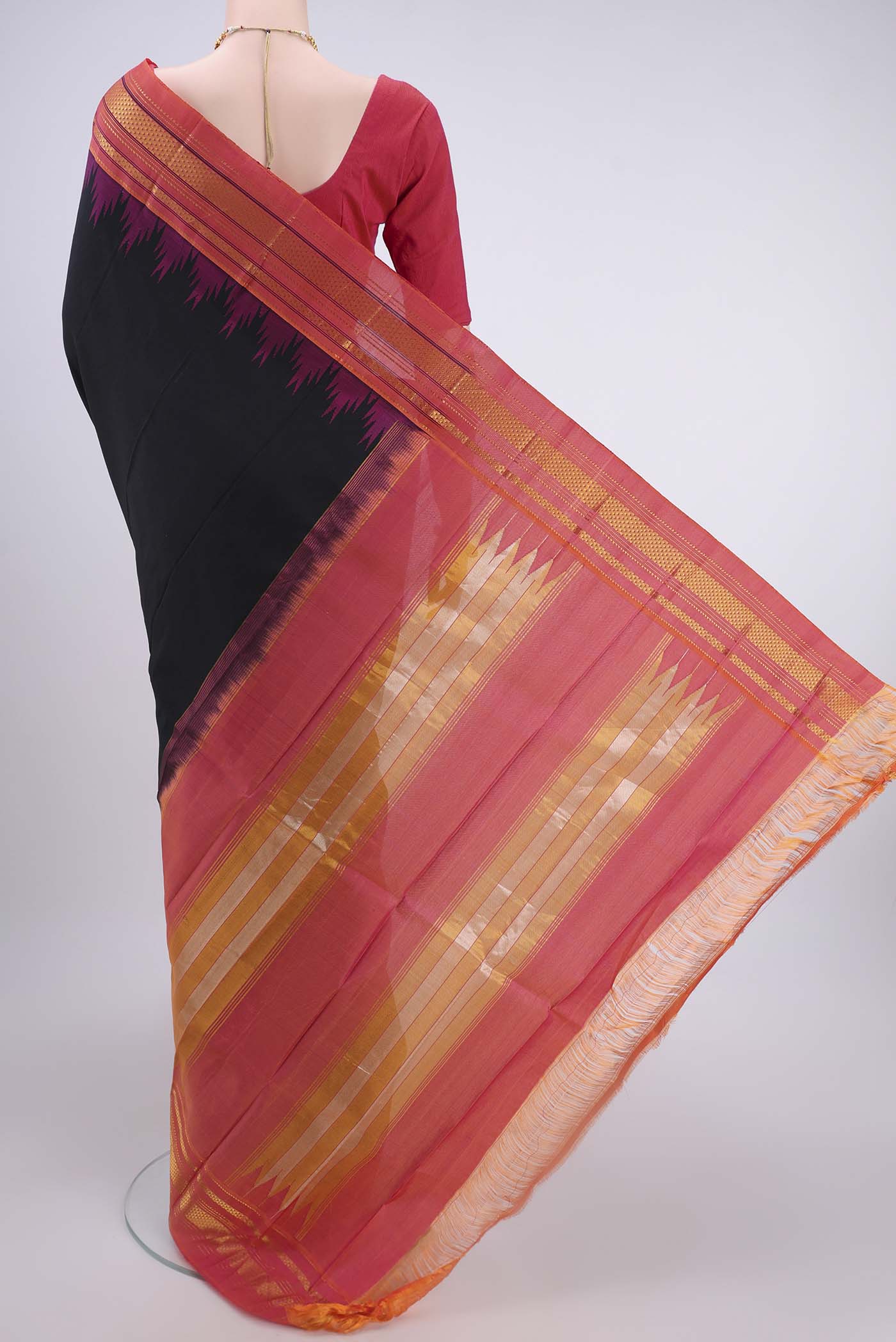 Flat view of Black Bangalore Silk Saree with Plain Body and Temple Border. 