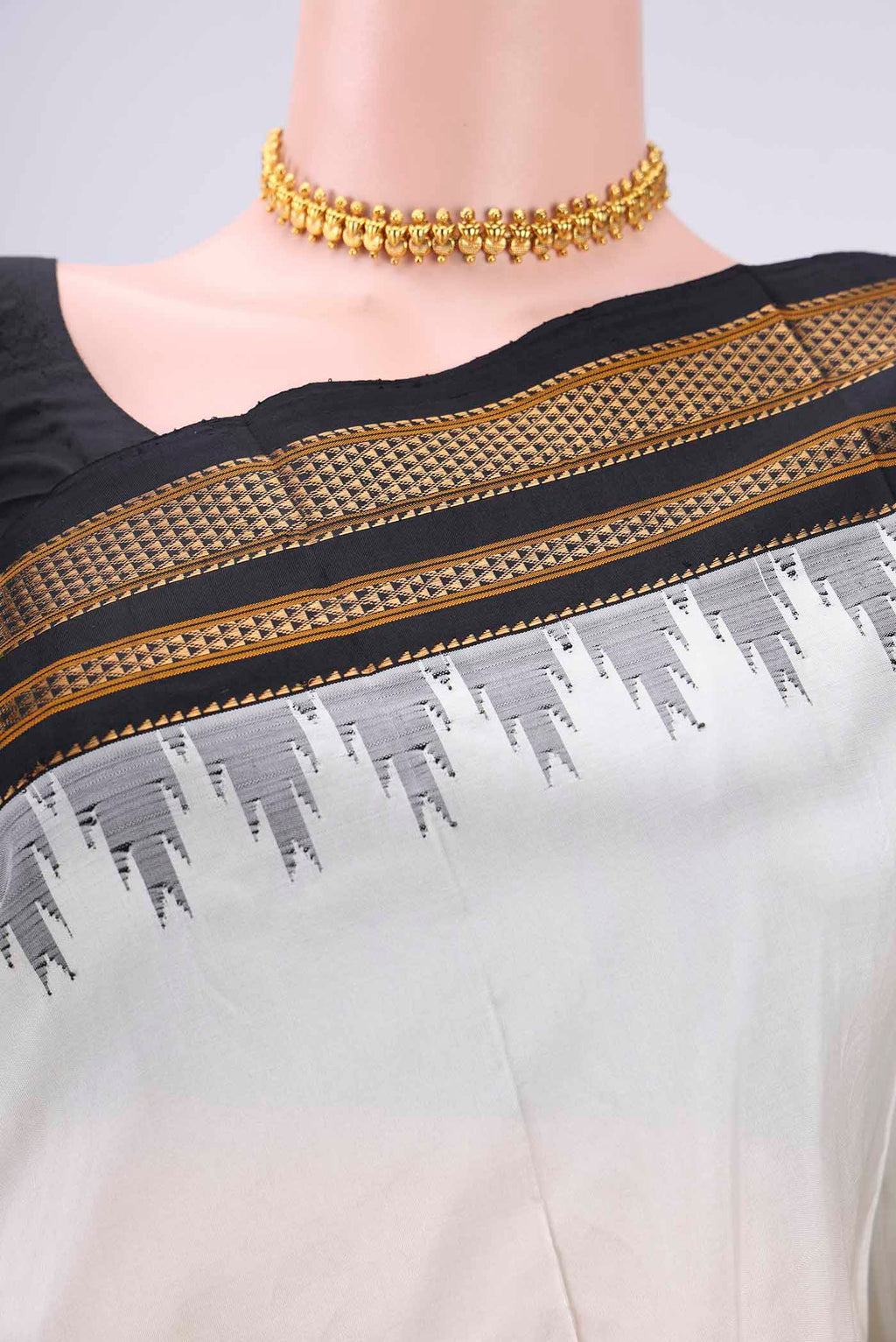 Border image of Off White Bangalore Silk Saree with Plain Body and Temple Border. 
