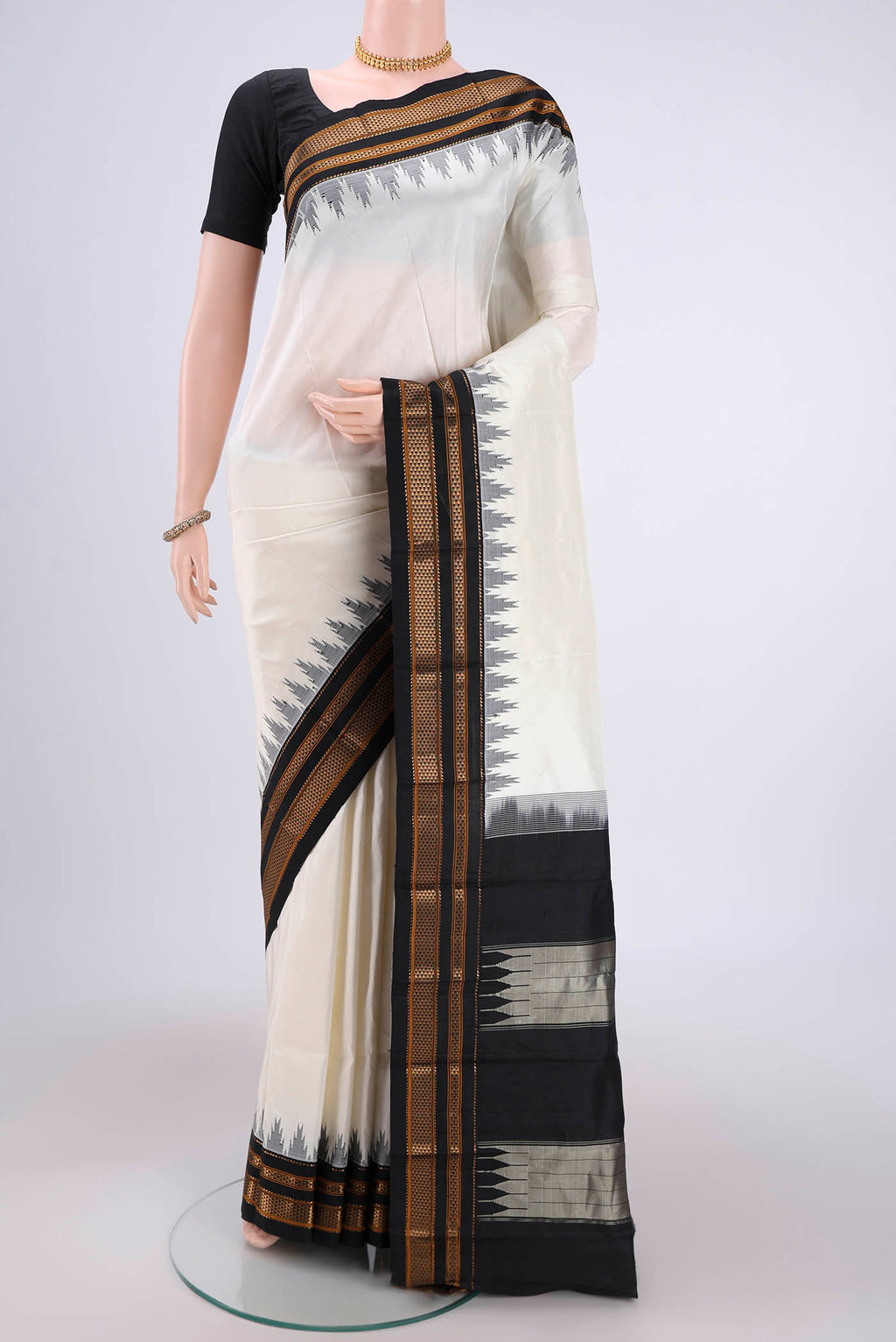 Off White Bangalore Silk Saree with Plain Body and Temple Border.  displayed on a mannequin