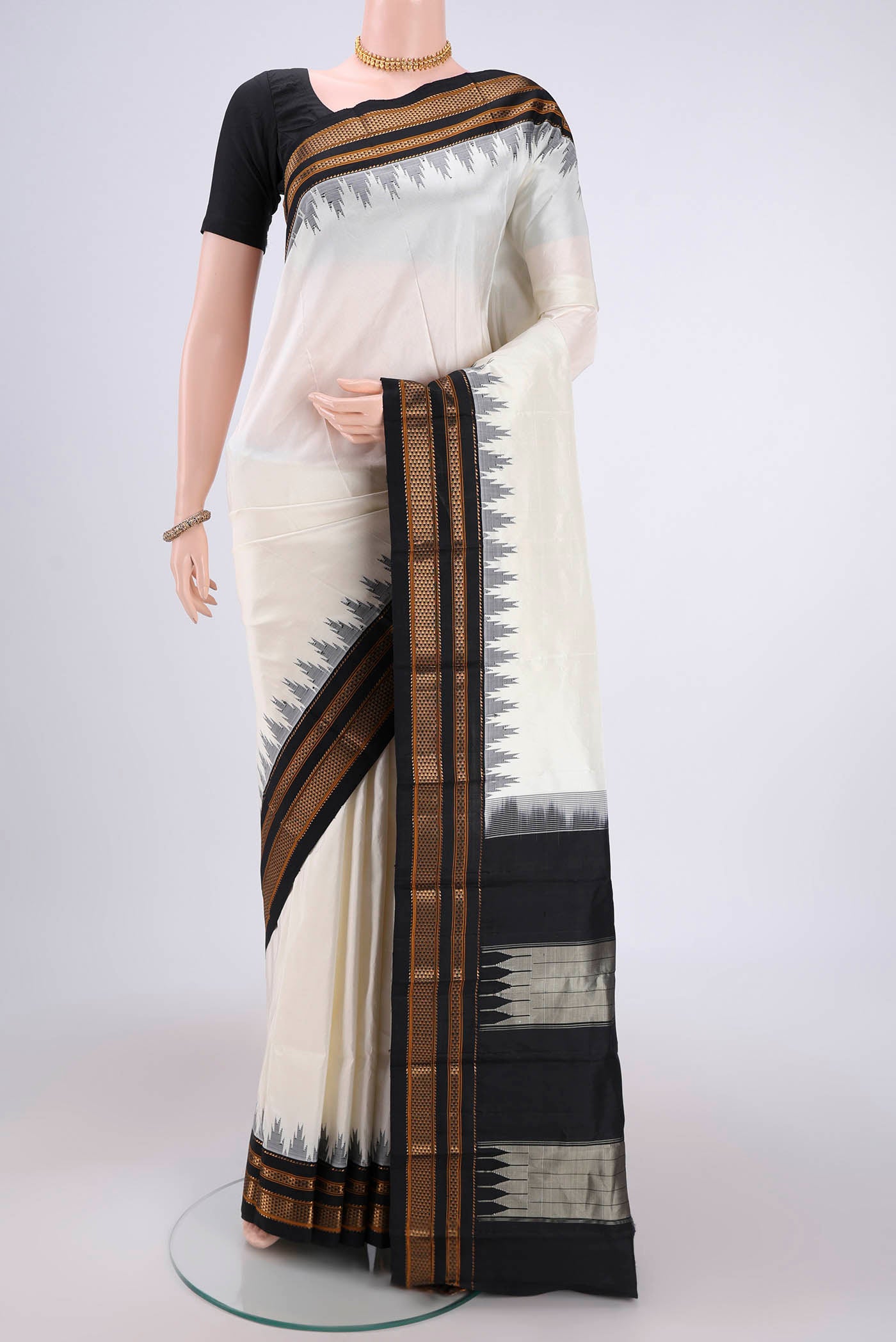 Off White Bangalore Silk Saree with Plain Body and Temple Border.  displayed on a mannequin