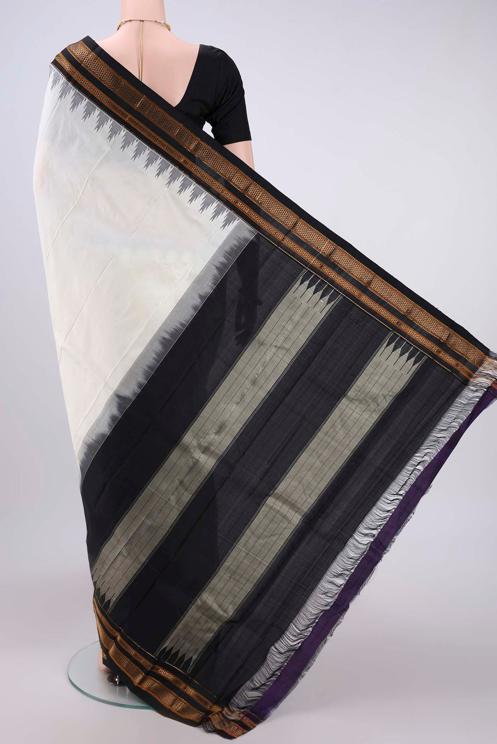 Flat view of Off White Bangalore Silk Saree with Plain Body and Temple Border. 