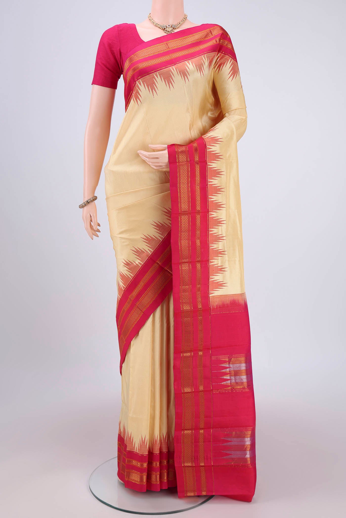 Cream Bangalore Silk Saree with Plain Body and Temple Border.  displayed on a mannequin