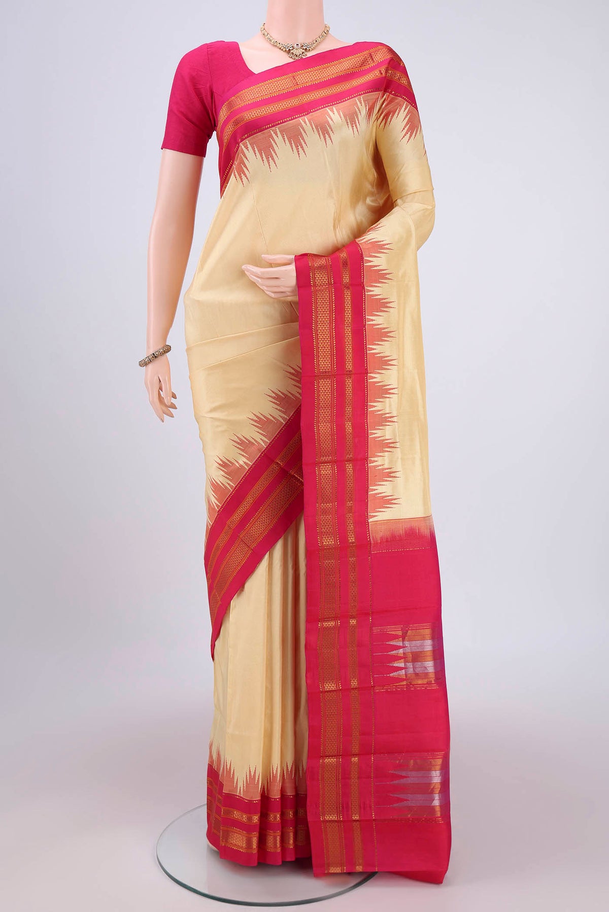 Cream Bangalore Silk Saree with Plain Body and Temple Border.  displayed on a mannequin