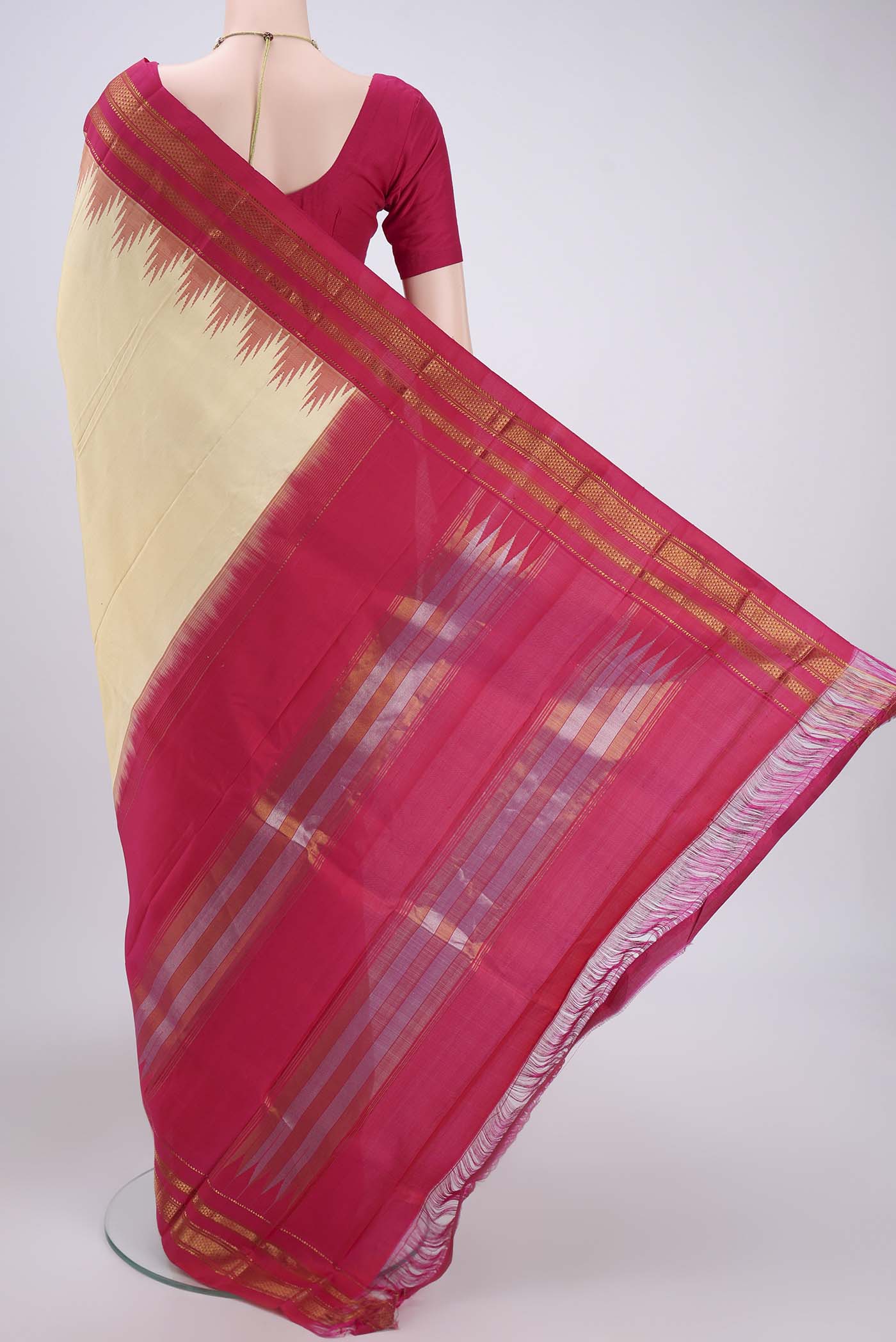 Flat view of Cream Bangalore Silk Saree with Plain Body and Temple Border. 