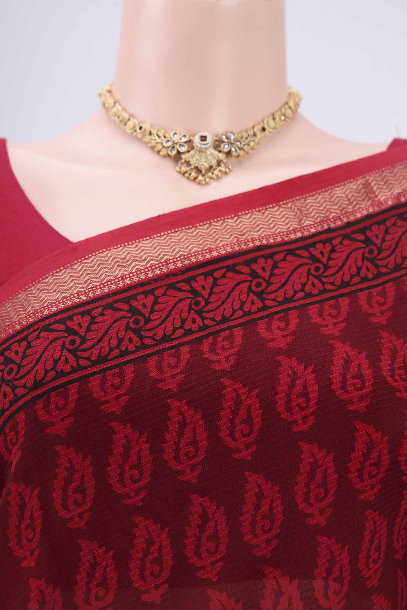 Border image of Red Maheshwari Silk Cotton Saree with Batik Print on the body and Zari Border. 