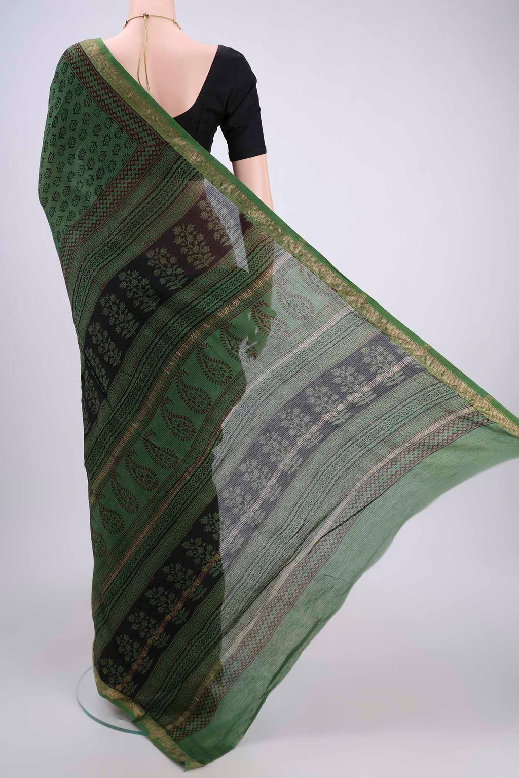 Flat view of Green Maheshwari Silk Cotton Saree with Batik Print on the body and Zari Border. 
