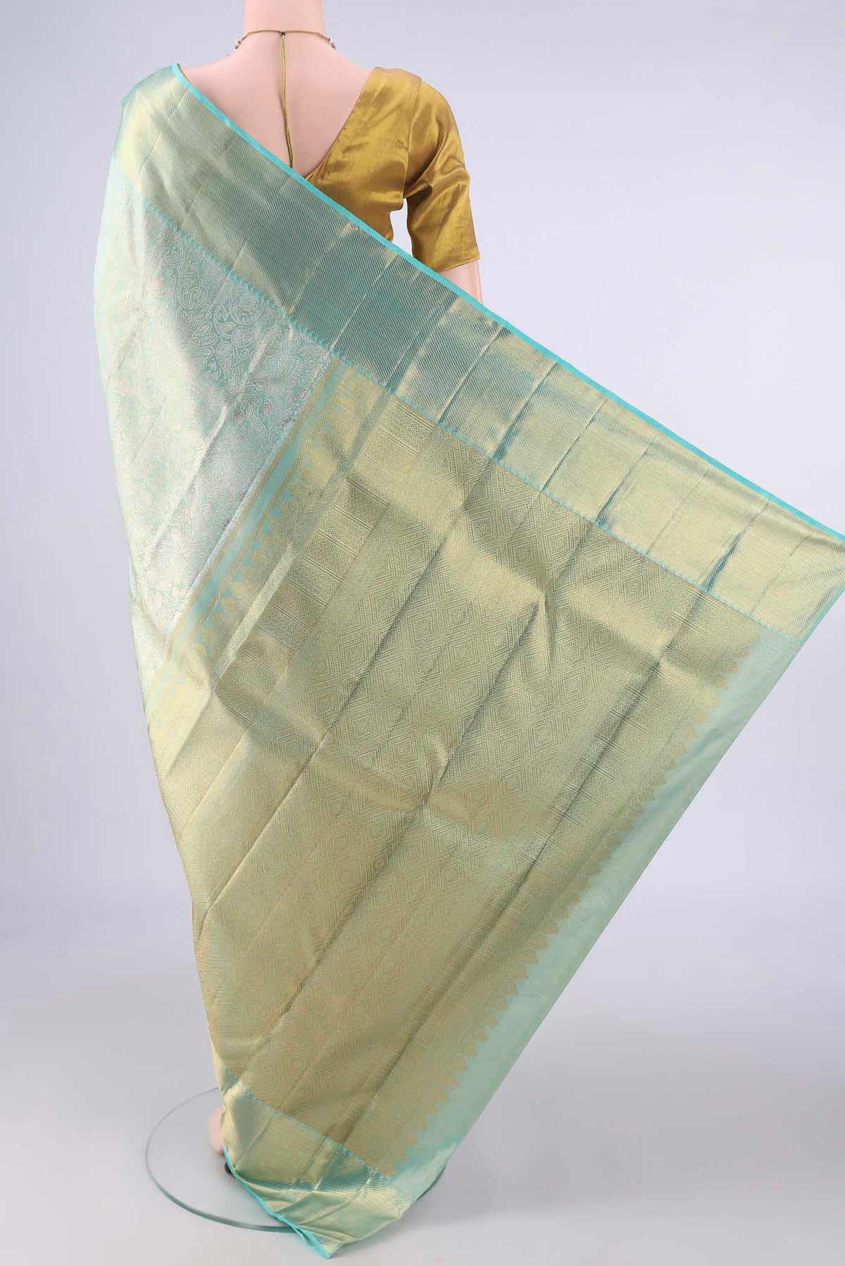 Flat view of Pure Silk Pure Zari Turquoise Dual Tone Kanjivaram Tissue Saree with Zari Brocade on the body and Zari Border. 