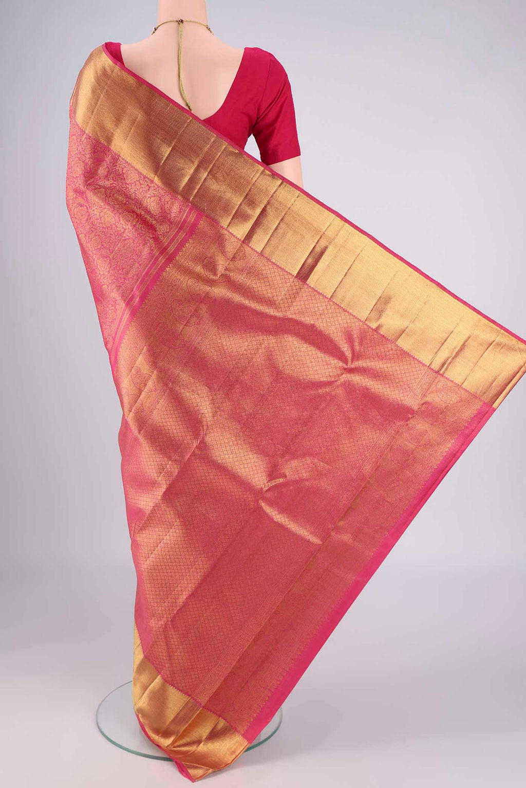 Flat view of Pure Silk Pure Zari Pink Kanjivaram Saree with Zari Brocade on the body and Zari Border. 