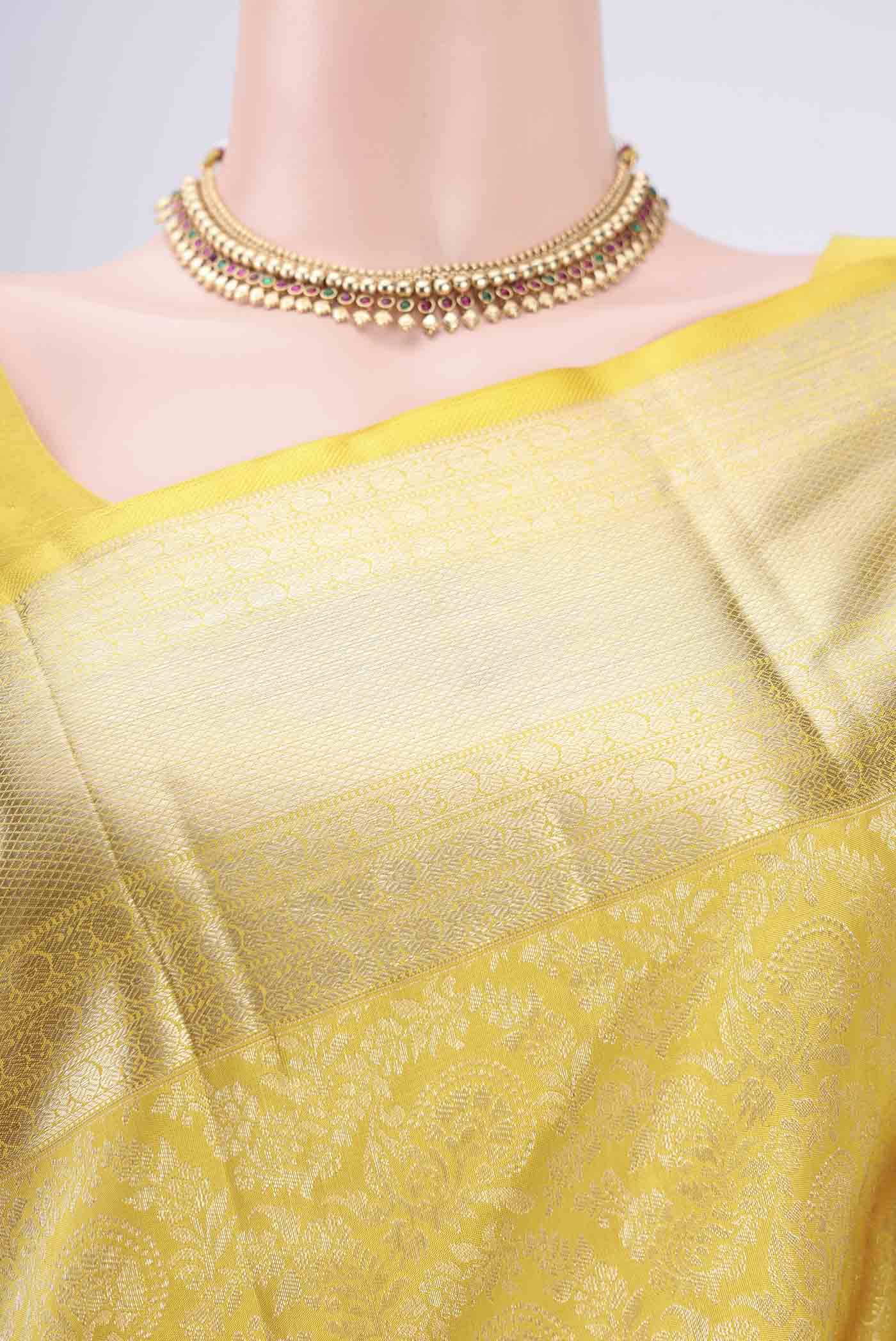 Border image of Lemon Yellow Kanchipuram Silk Saree with Zari Brocade on the body and Zari Border. 
