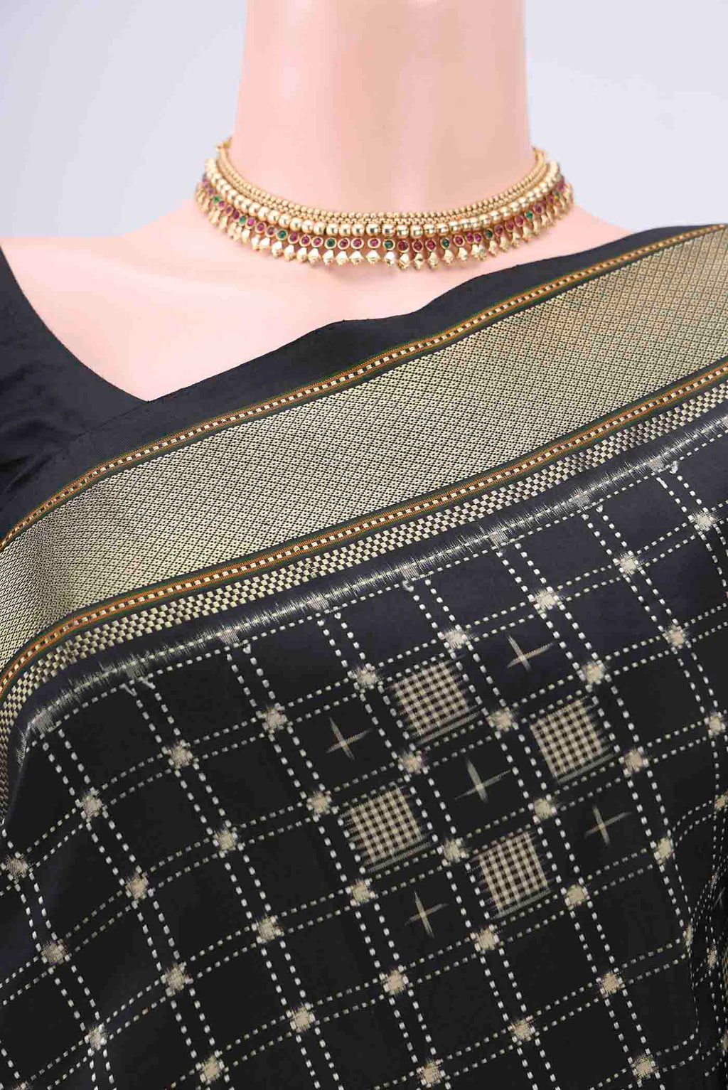 Border image of Black Pochampally Silk Saree with Checked design on the body and Zari Border. 