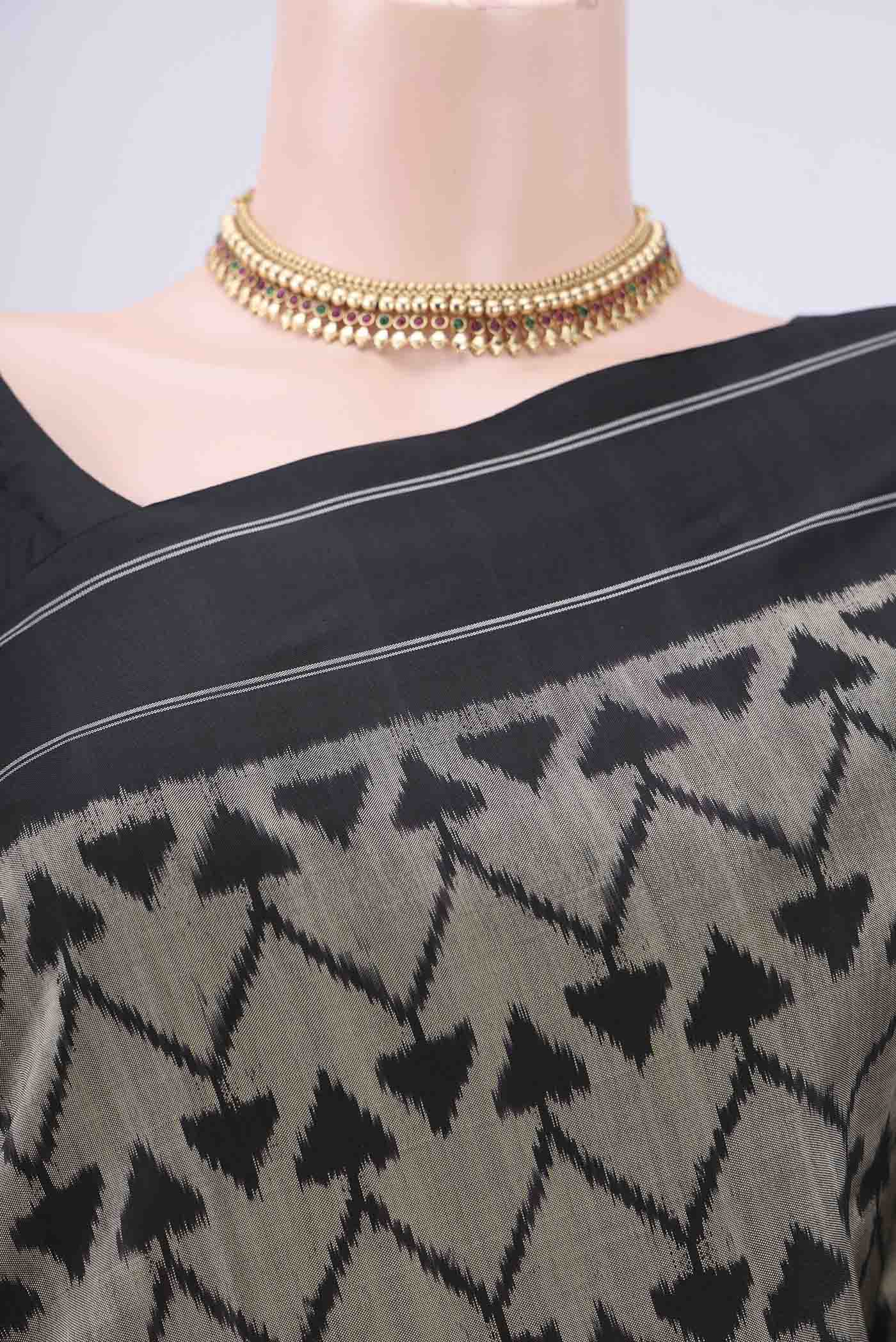 Border image of Davys Grey Pochampally Silk Saree with Ikat design on the body and Zari Border. 