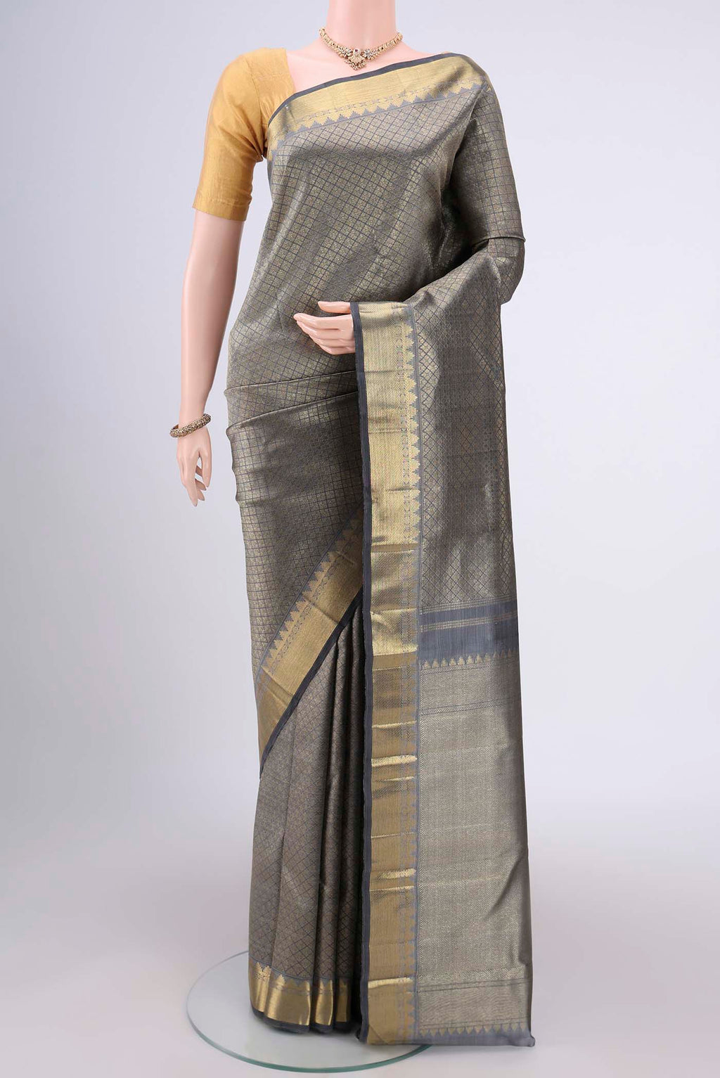 Pure Silk Pure Zari Grey Kanjivaram Saree with Zari Brocade on the body and Zari Border.  displayed on a mannequin