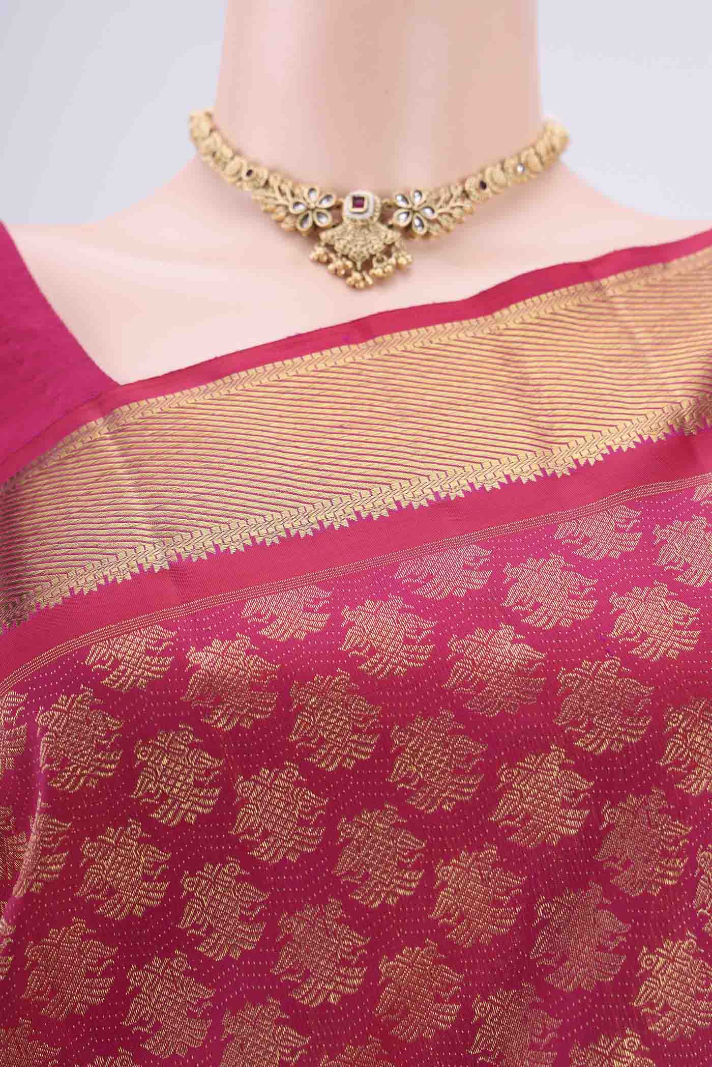 Border image of Pure Silk Pure Zari Rani Pink Kanjivaram Saree with Zari Butta on the body and Zari Border. 