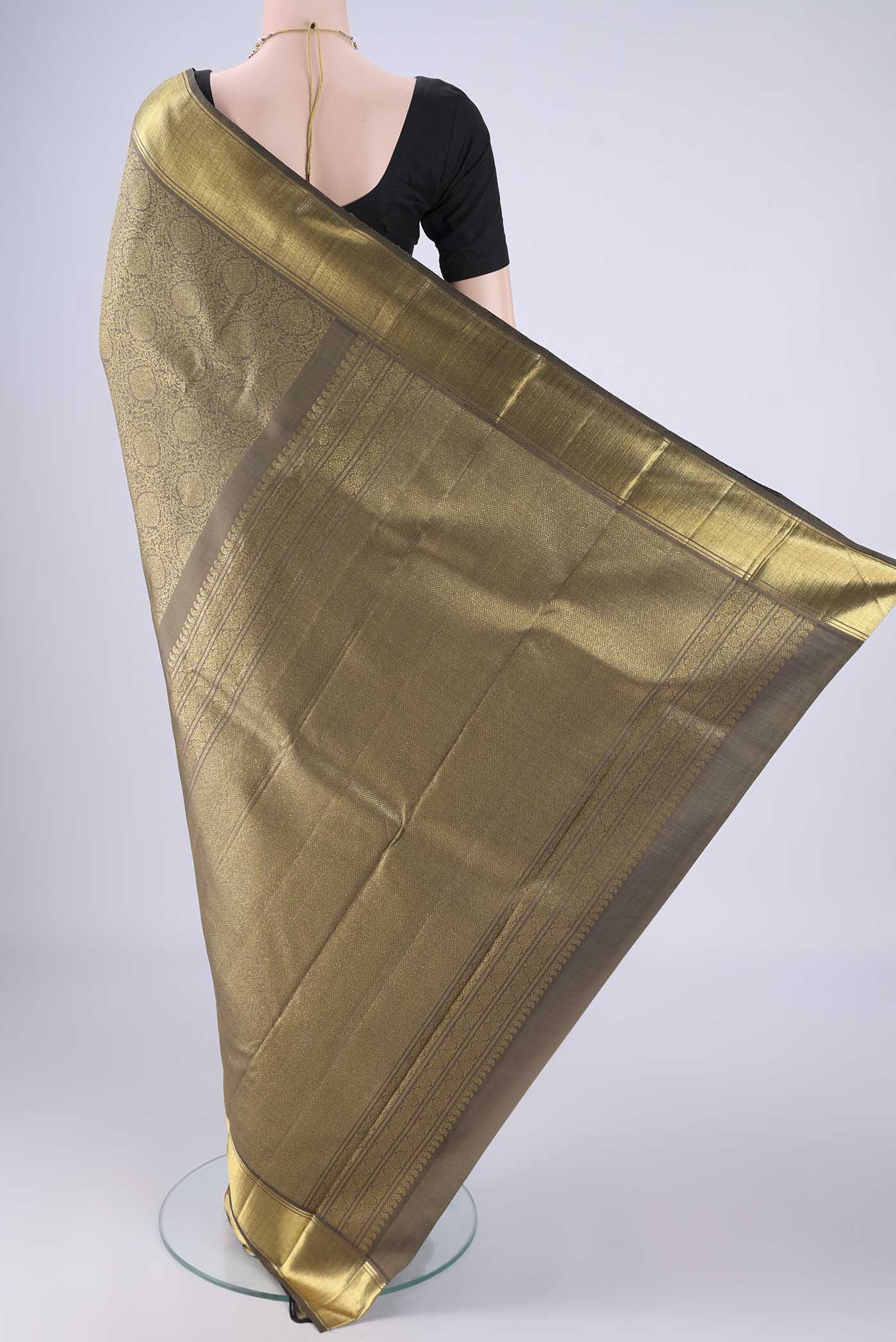Flat view of Pure Silk Pure Zari Davys Grey Kanjivaram Saree with Zari Butta on the body and Zari Border. 